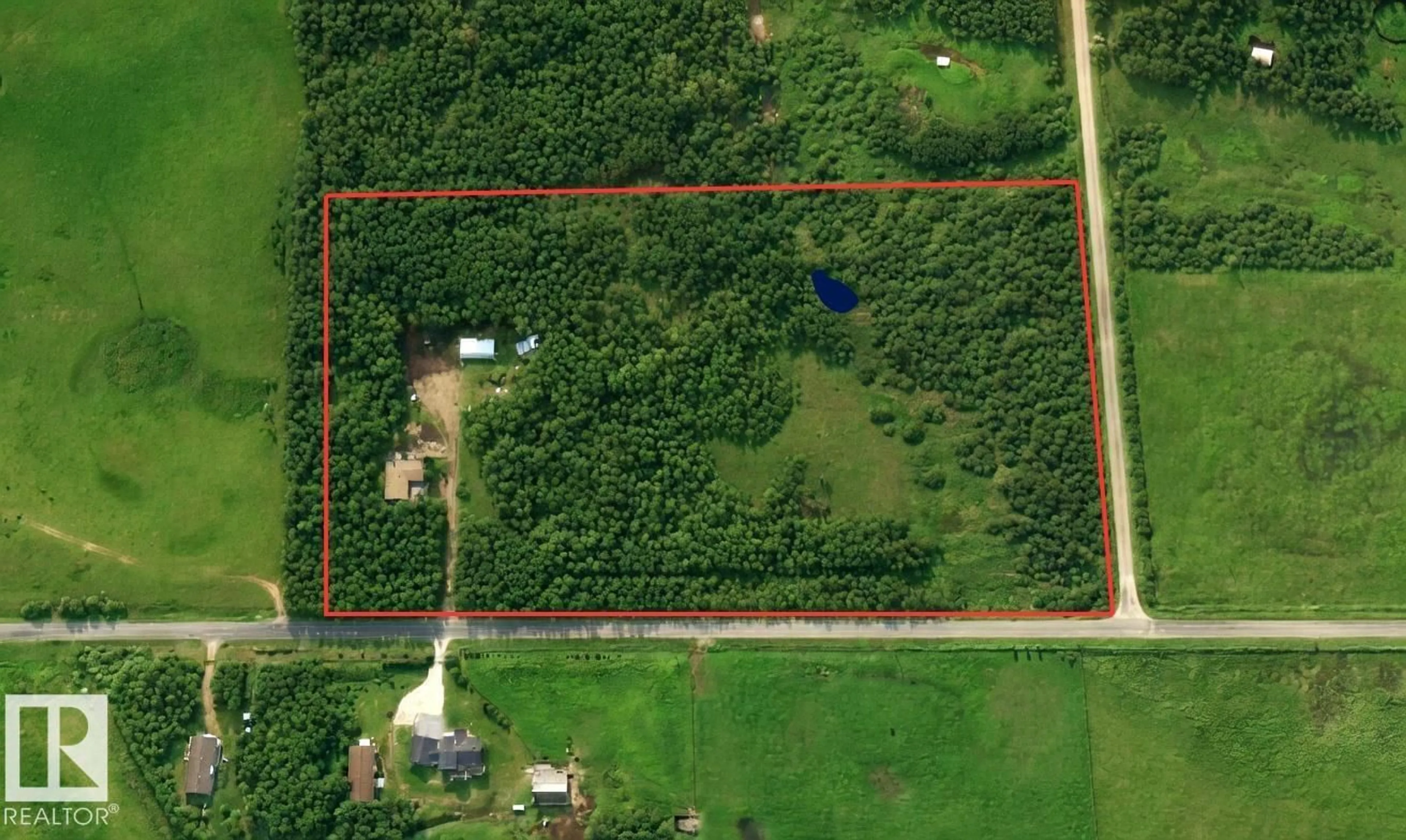 A pic from outside/outdoor area/front of a property/back of a property/a pic from drone, building for 22443 TWP ROAD 512, Rural Strathcona County Alberta T8C1H3