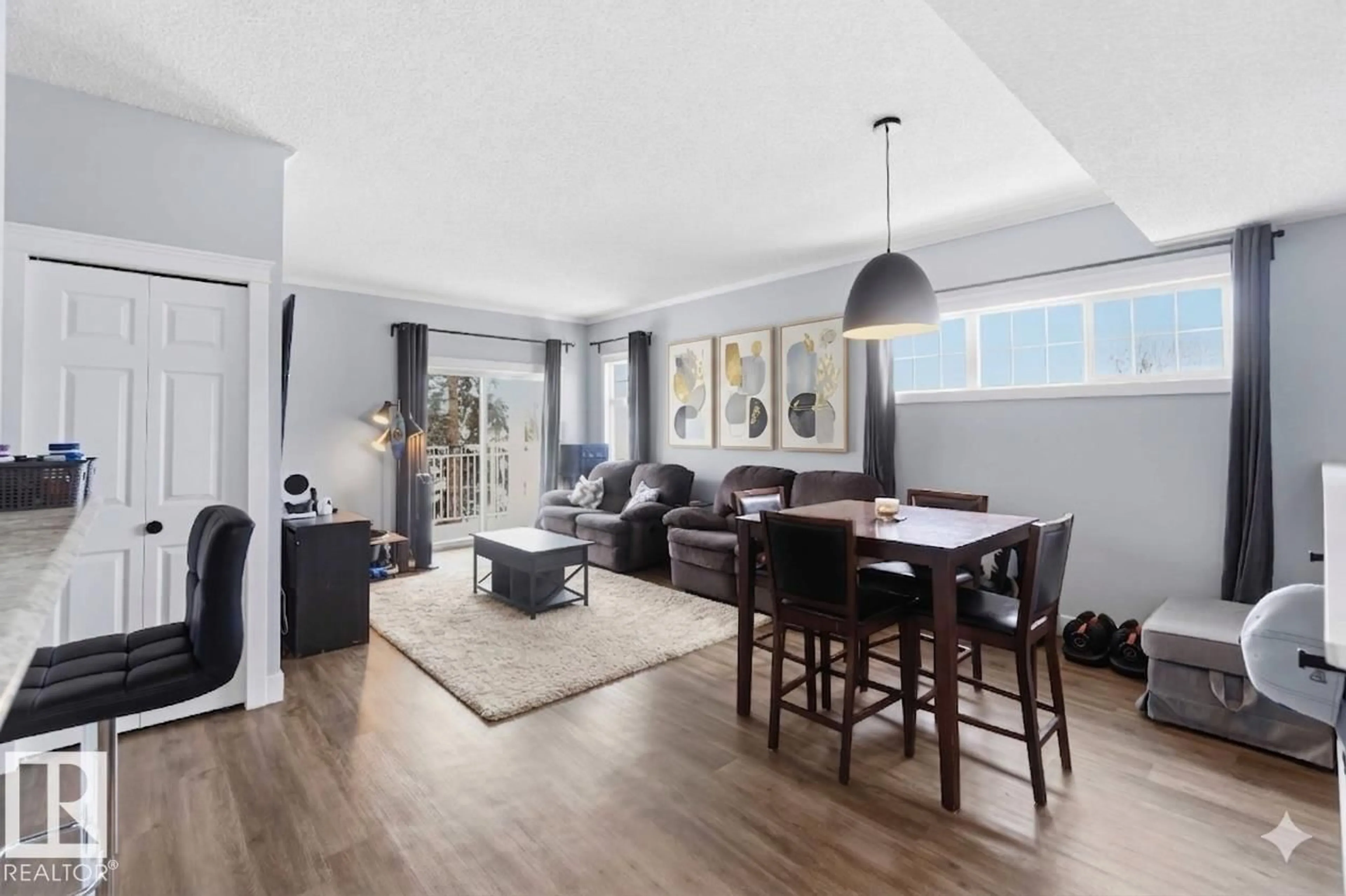 Living room with furniture, wood/laminate floor for SW - #11 1179 SUMMERSIDE DR, Edmonton Alberta T6X1K1