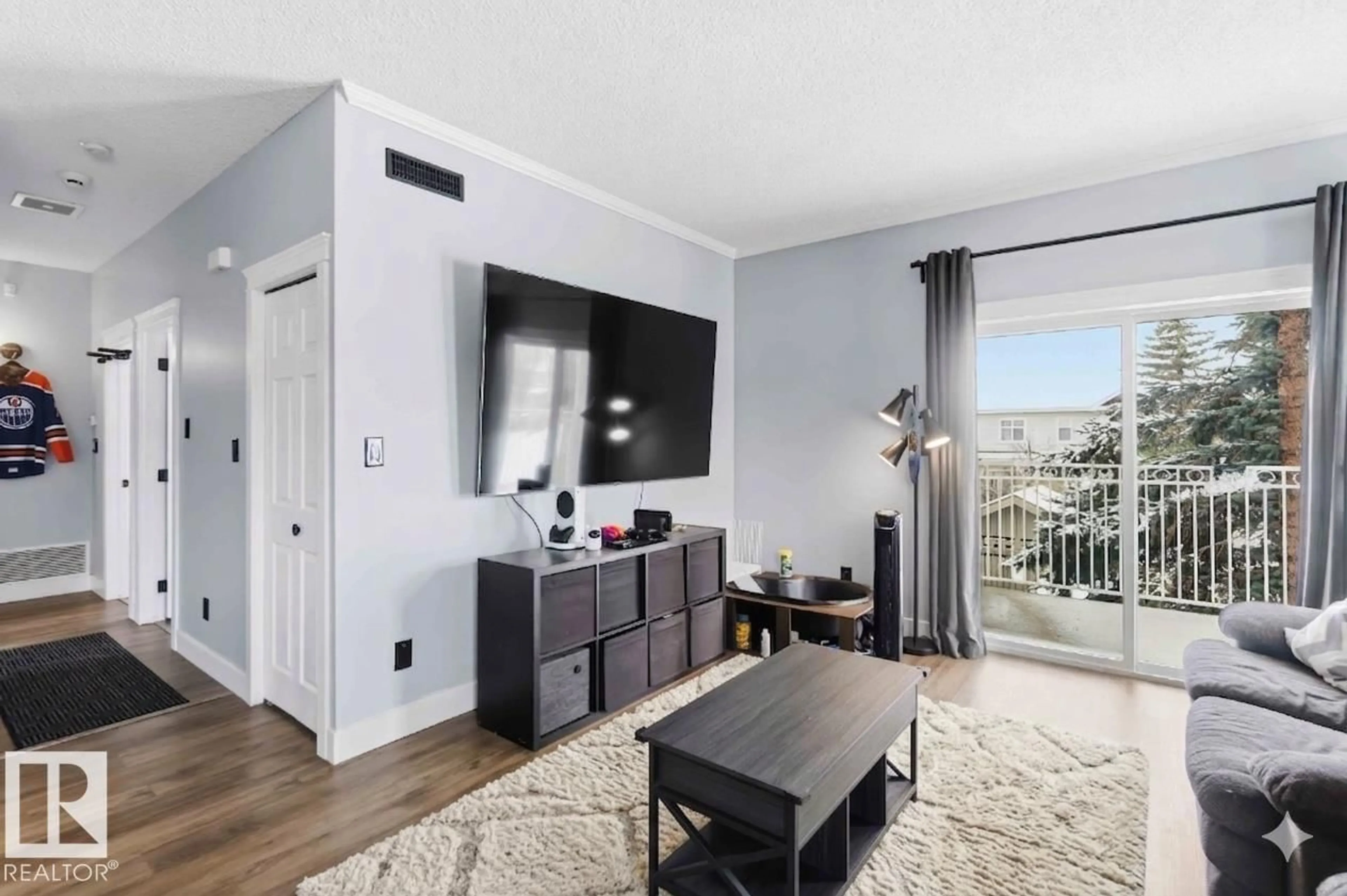 Living room with furniture, wood/laminate floor for SW - #11 1179 SUMMERSIDE DR, Edmonton Alberta T6X1K1