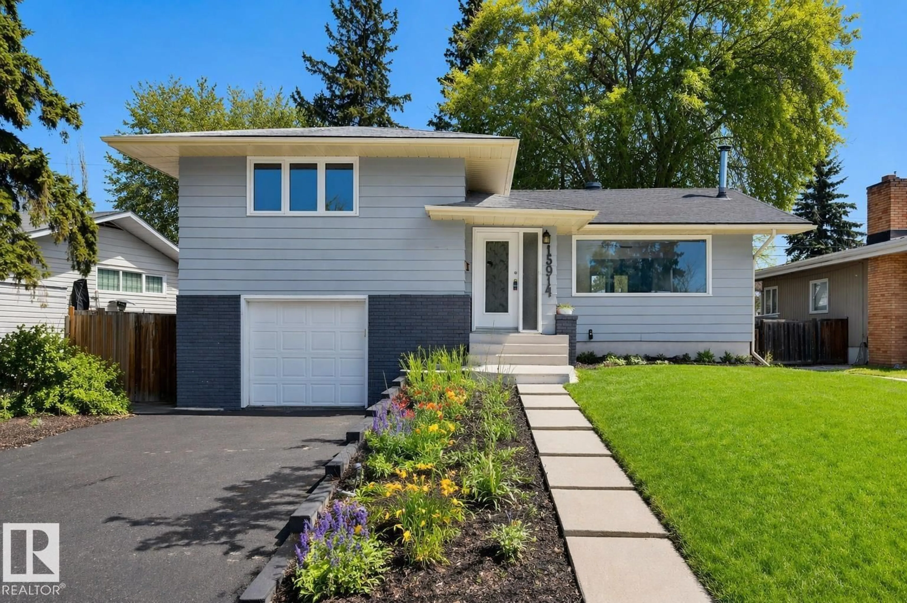 Home with vinyl exterior material, street for 15914 92A AV, Edmonton Alberta T5R5G3