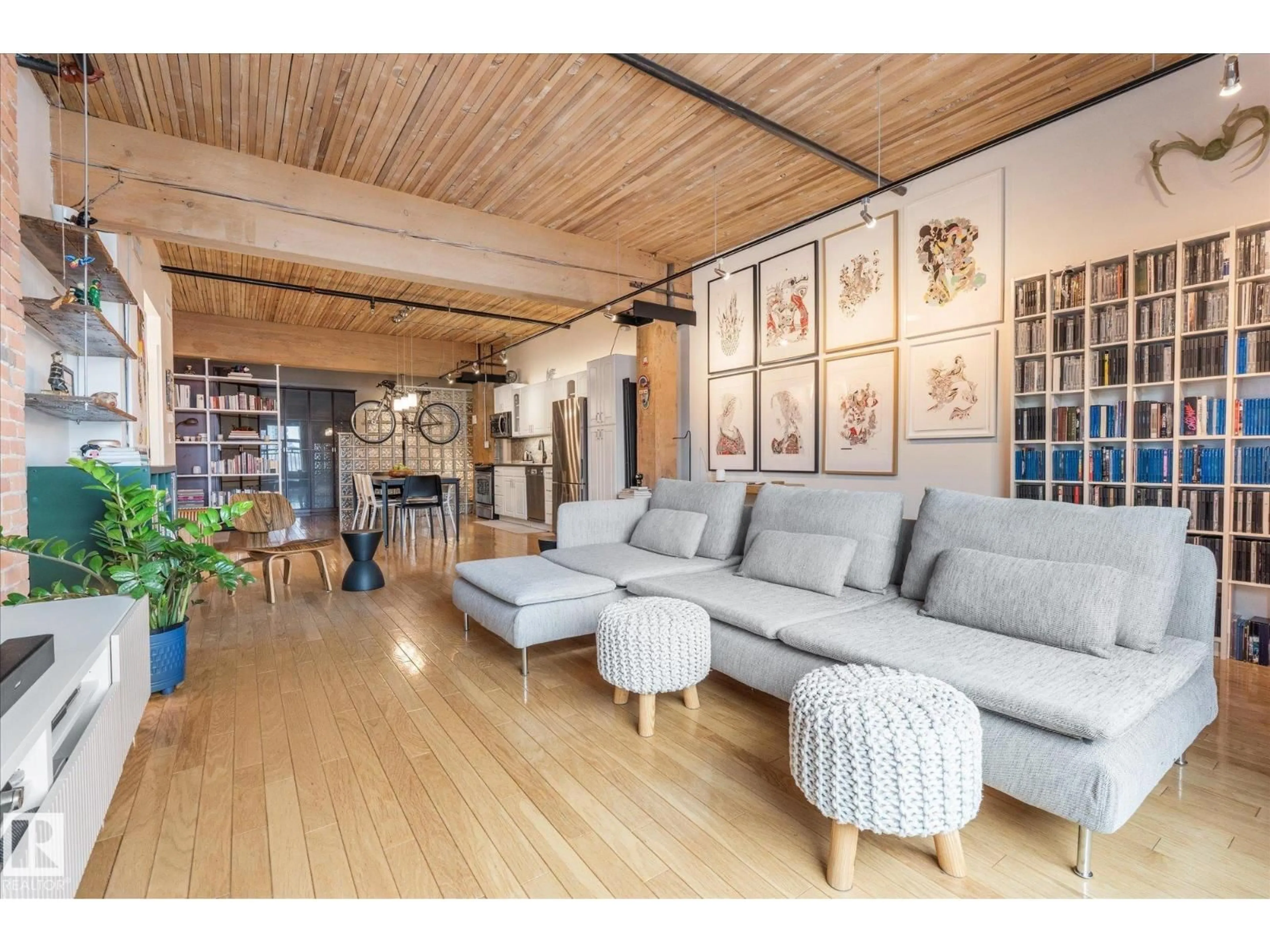 Living room with furniture, wood/laminate floor for 310 - 10301 109 ST, Edmonton Alberta T5J1N4