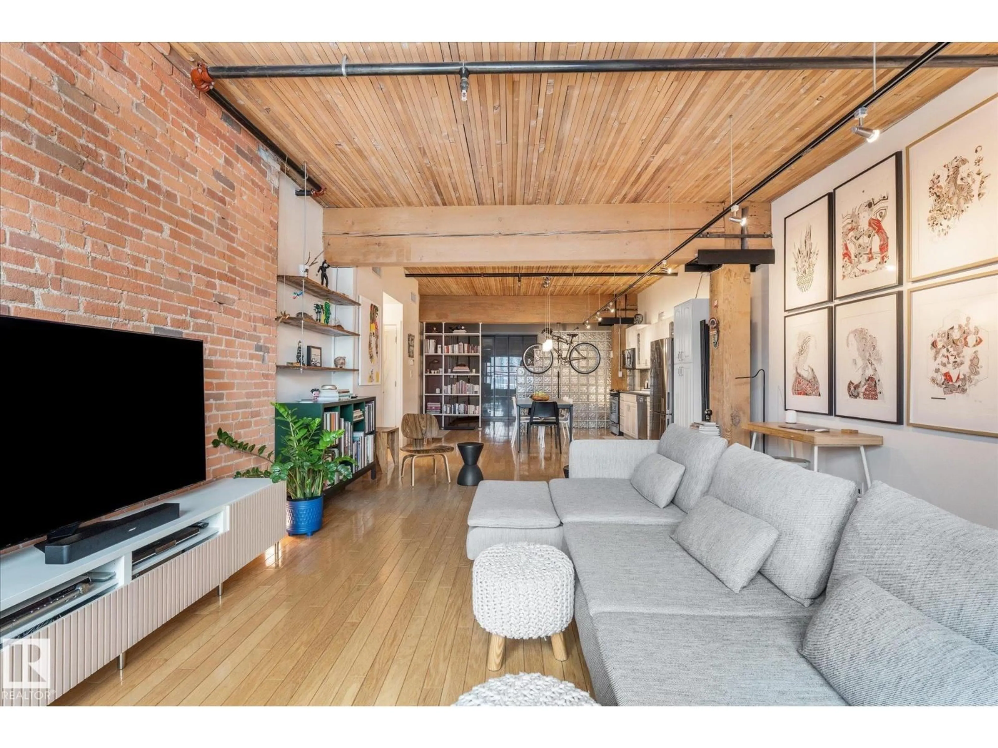 Living room with furniture, wood/laminate floor for 310 - 10301 109 ST, Edmonton Alberta T5J1N4