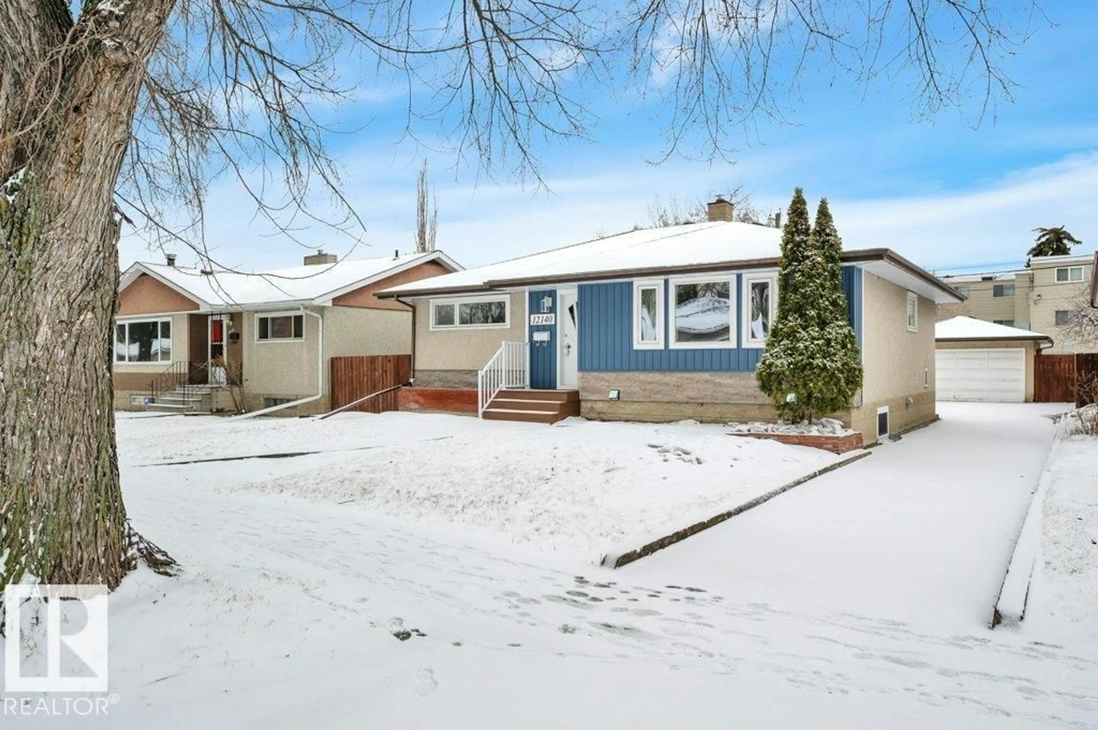 Home with vinyl exterior material, street for 12140 53 ST, Edmonton Alberta T5W3L9