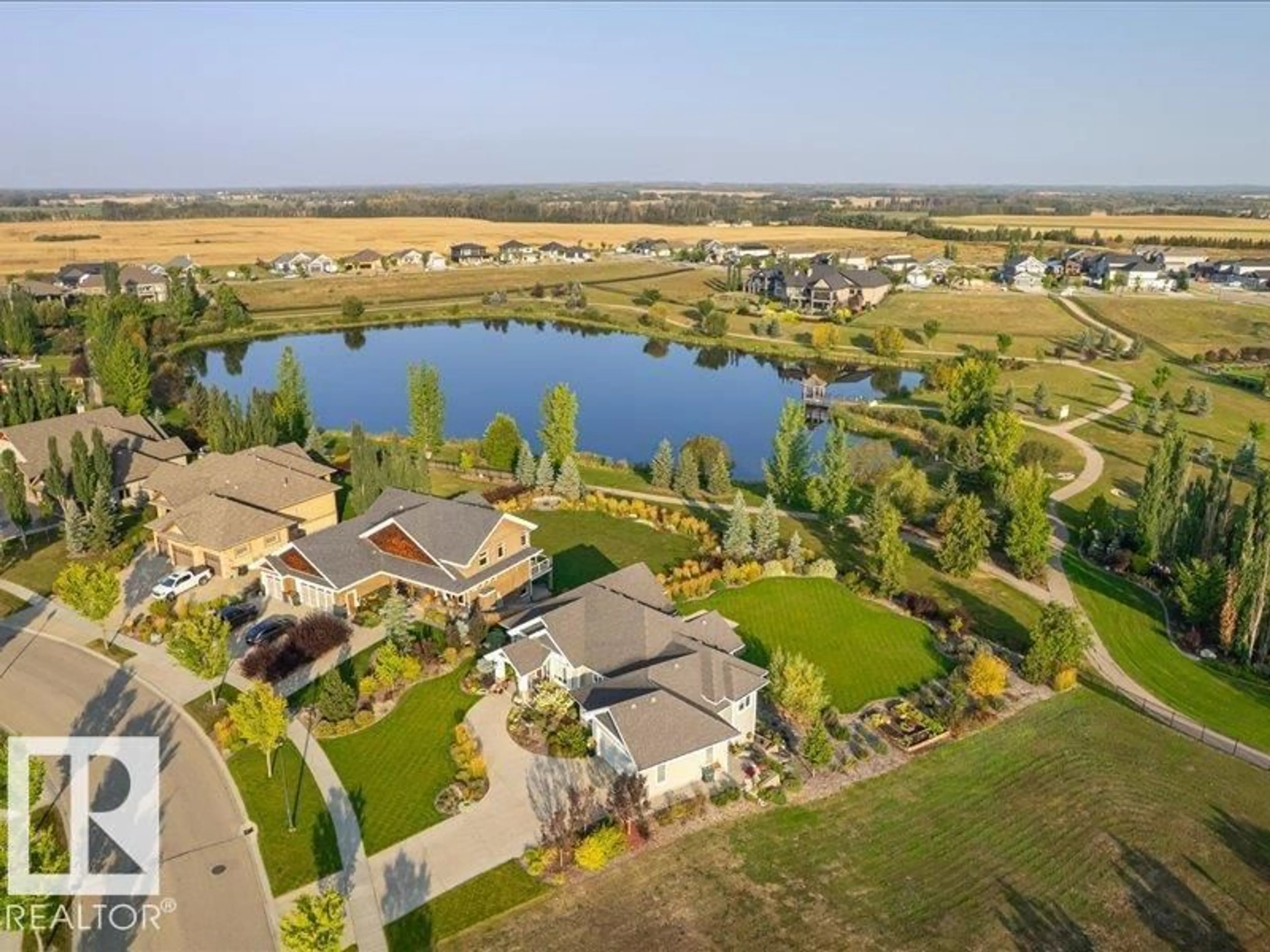 A pic from outside/outdoor area/front of a property/back of a property/a pic from drone, water/lake/river/ocean view for 1079 GENESIS LAKE BV, Stony Plain Alberta T7Z0G3