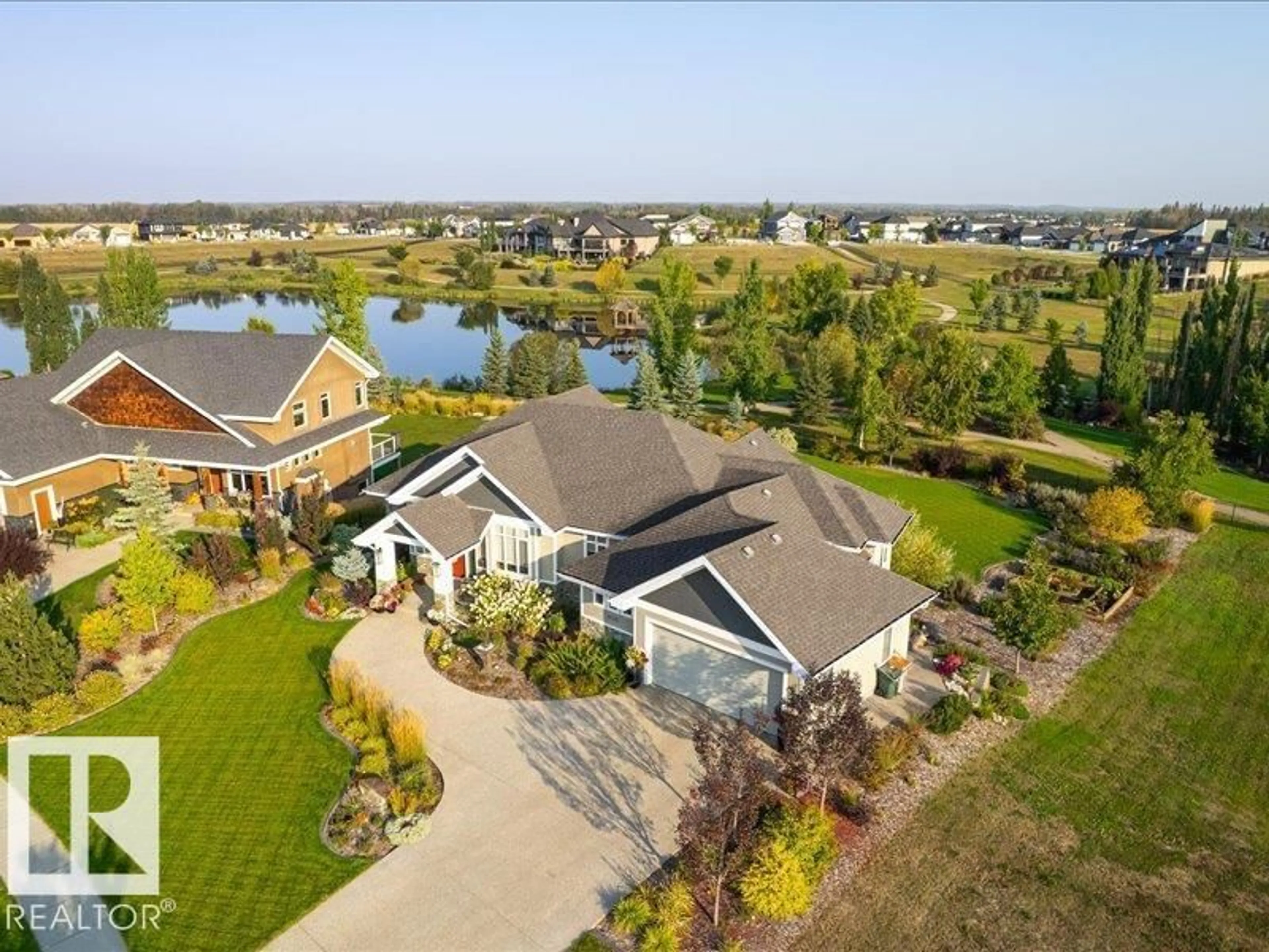 A pic from outside/outdoor area/front of a property/back of a property/a pic from drone, water/lake/river/ocean view for 1079 GENESIS LAKE BV, Stony Plain Alberta T7Z0G3