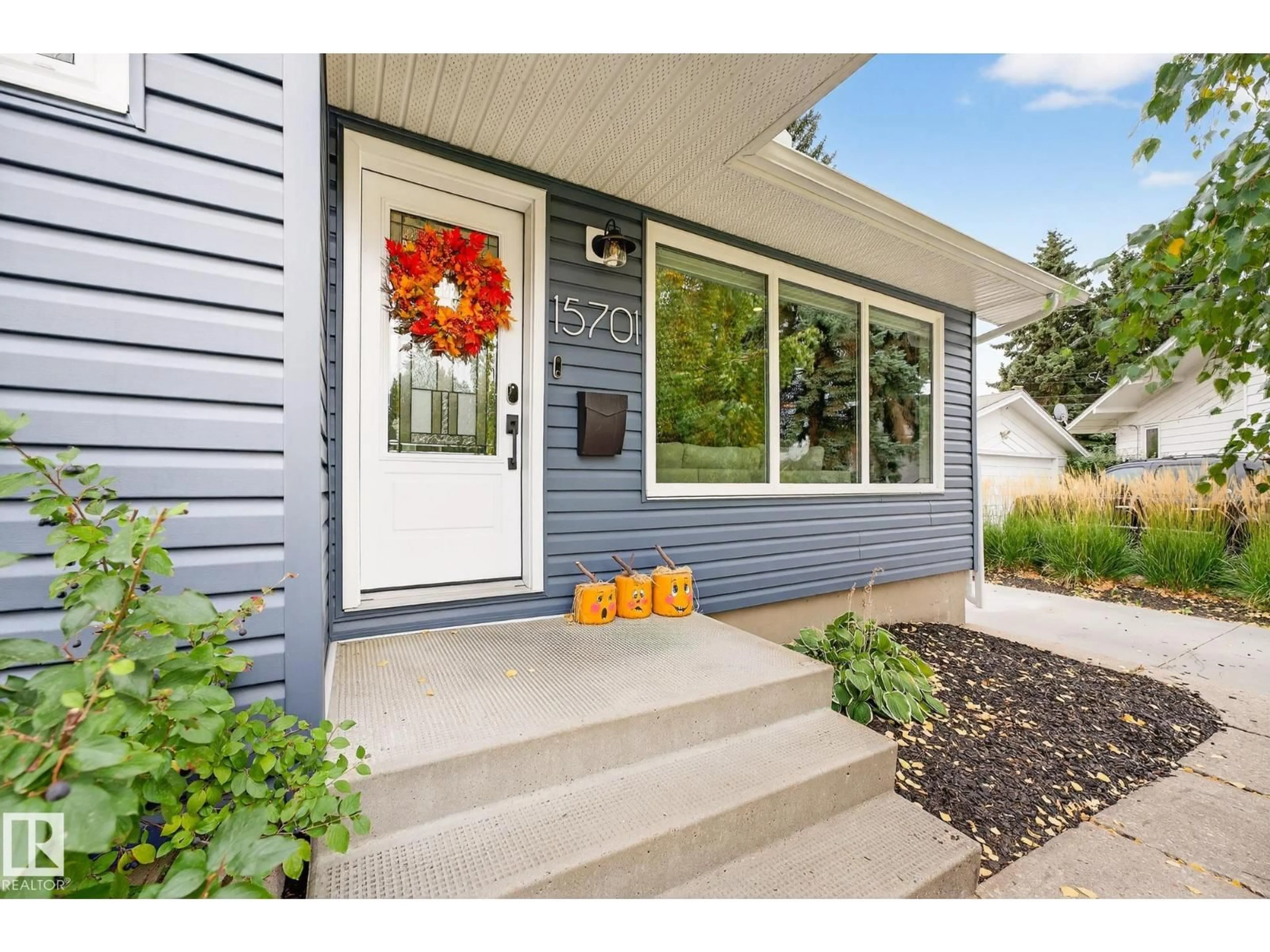 Home with vinyl exterior material, street for 15701 92A AV, Edmonton Alberta T5R5G1