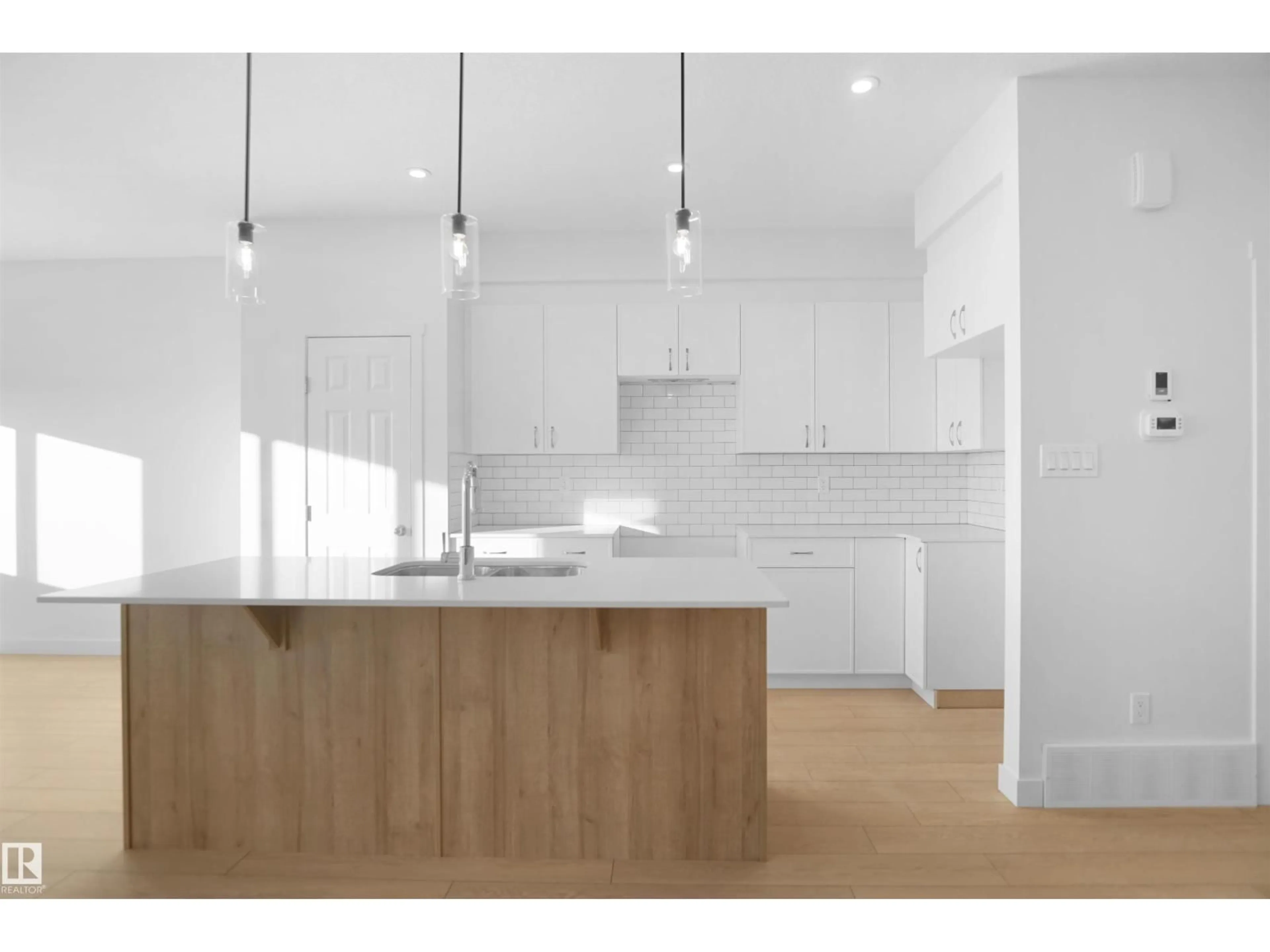 Open concept kitchen, wood/laminate floor for 13136 214 ST, Edmonton Alberta T5S0X1