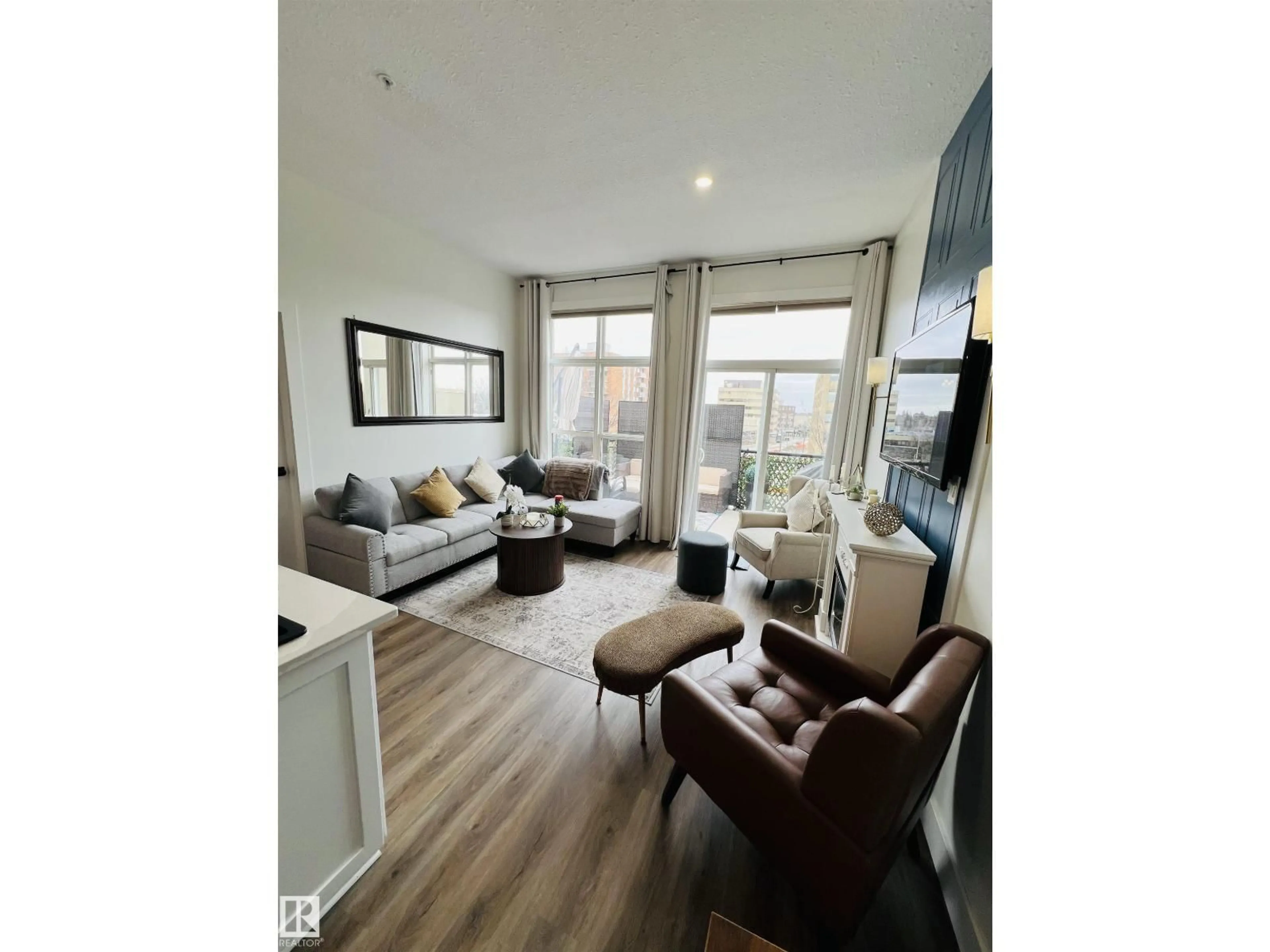 Living room with furniture, wood/laminate floor for #443 - 10403 122 ST, Edmonton Alberta T5N4C1