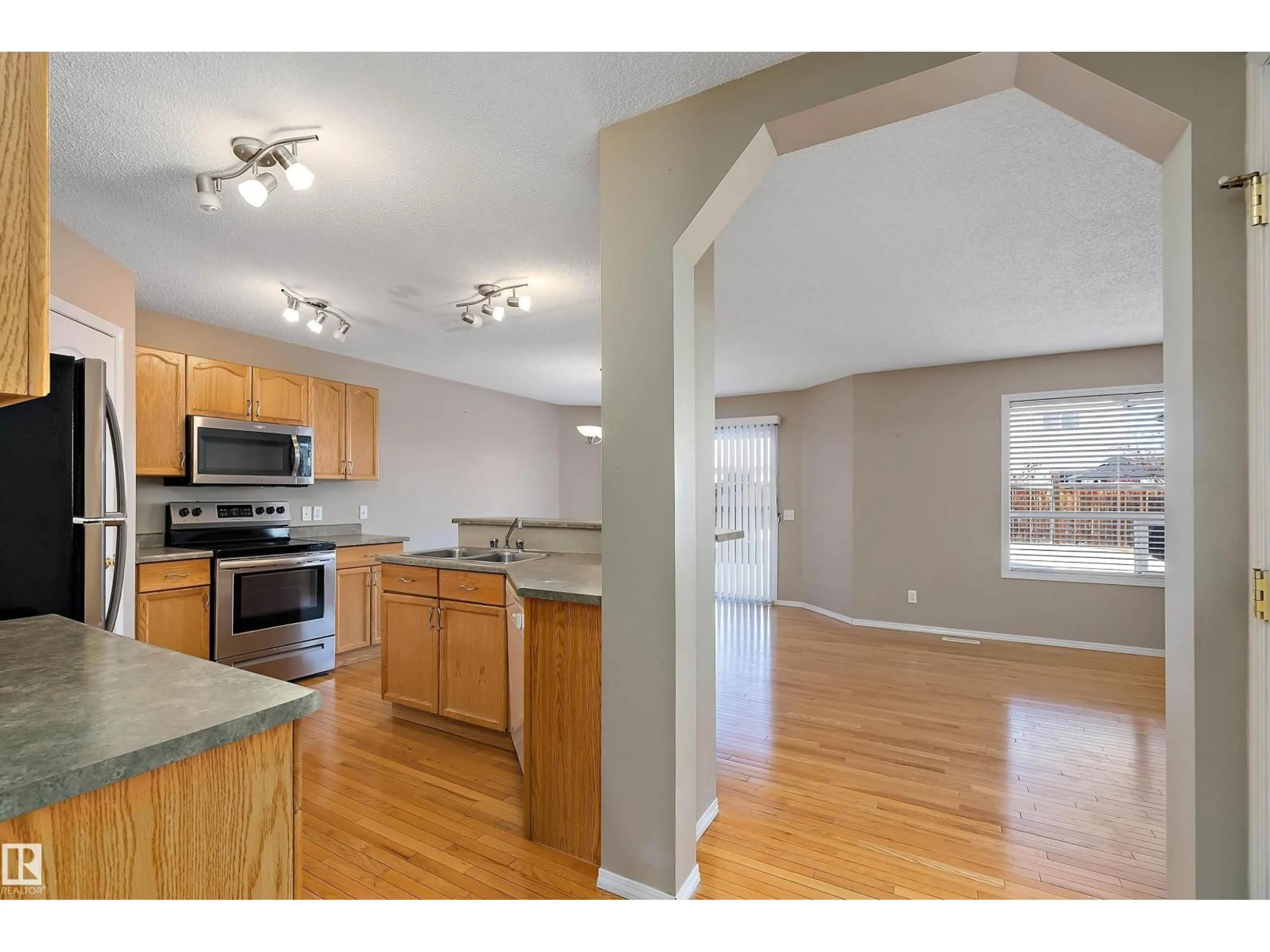 Open concept kitchen, wood/laminate floor for 17920 90 ST, Edmonton Alberta T5Z0A1