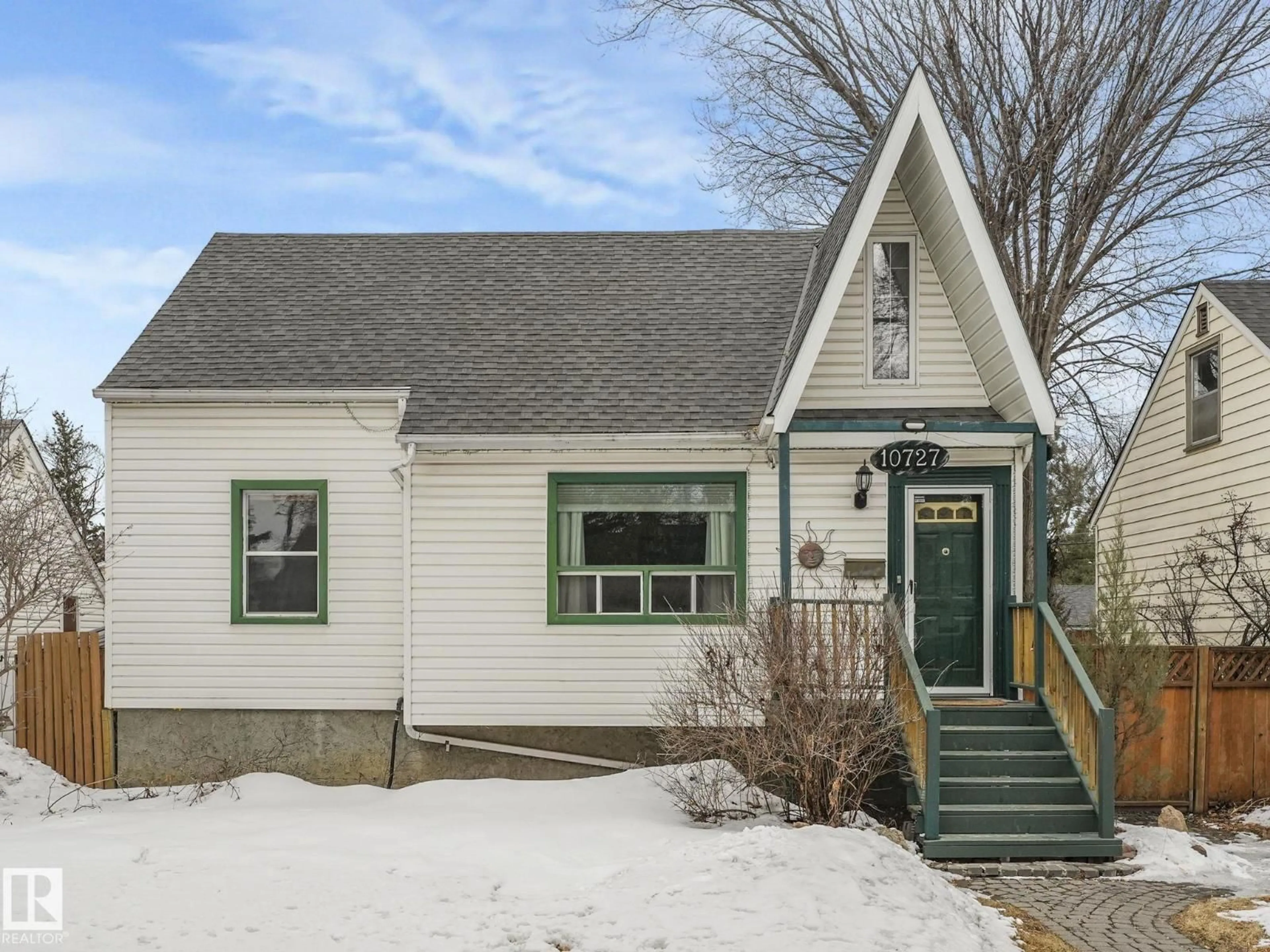 Home with vinyl exterior material, street for 10727 66 AV, Edmonton Alberta T6H1X7