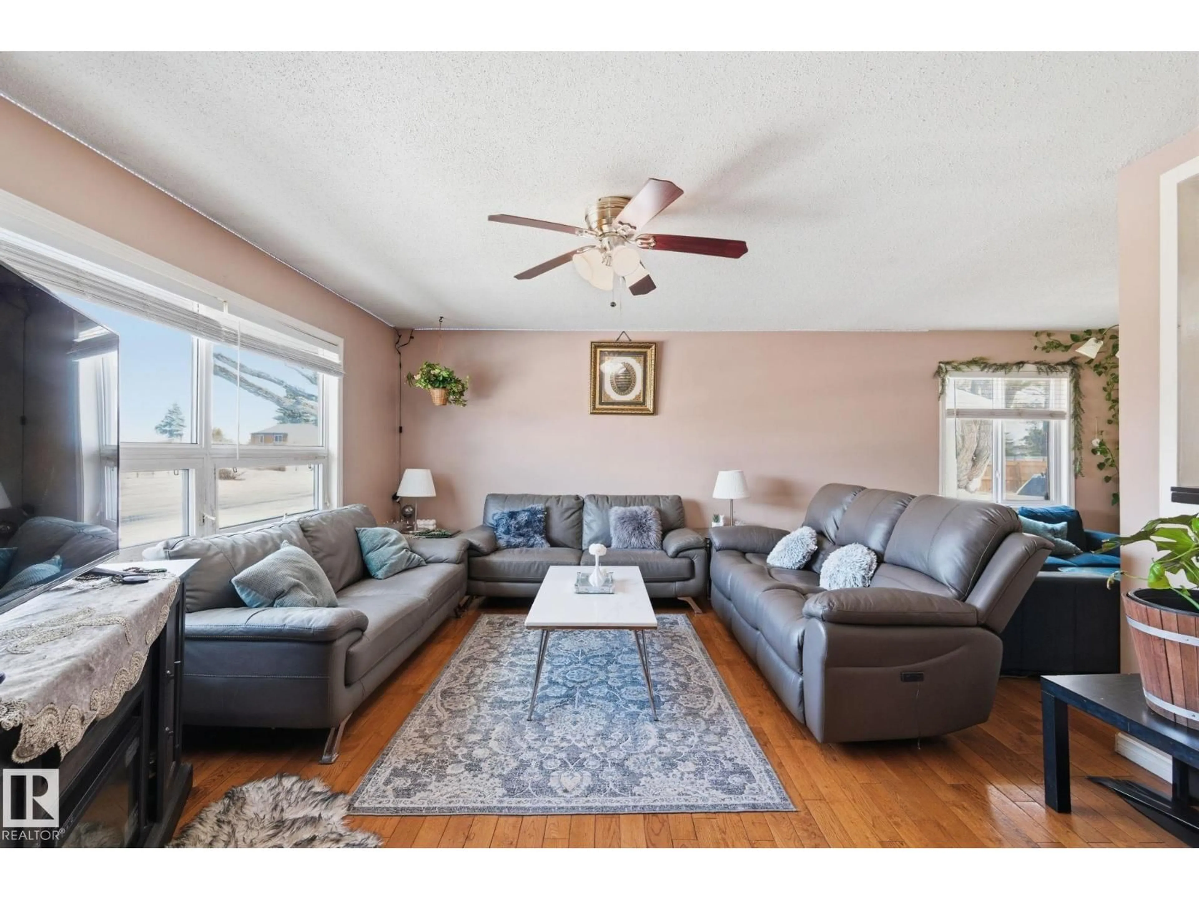 Living room with furniture, wood/laminate floor for 10617 167A AV, Edmonton Alberta T5X2Y9