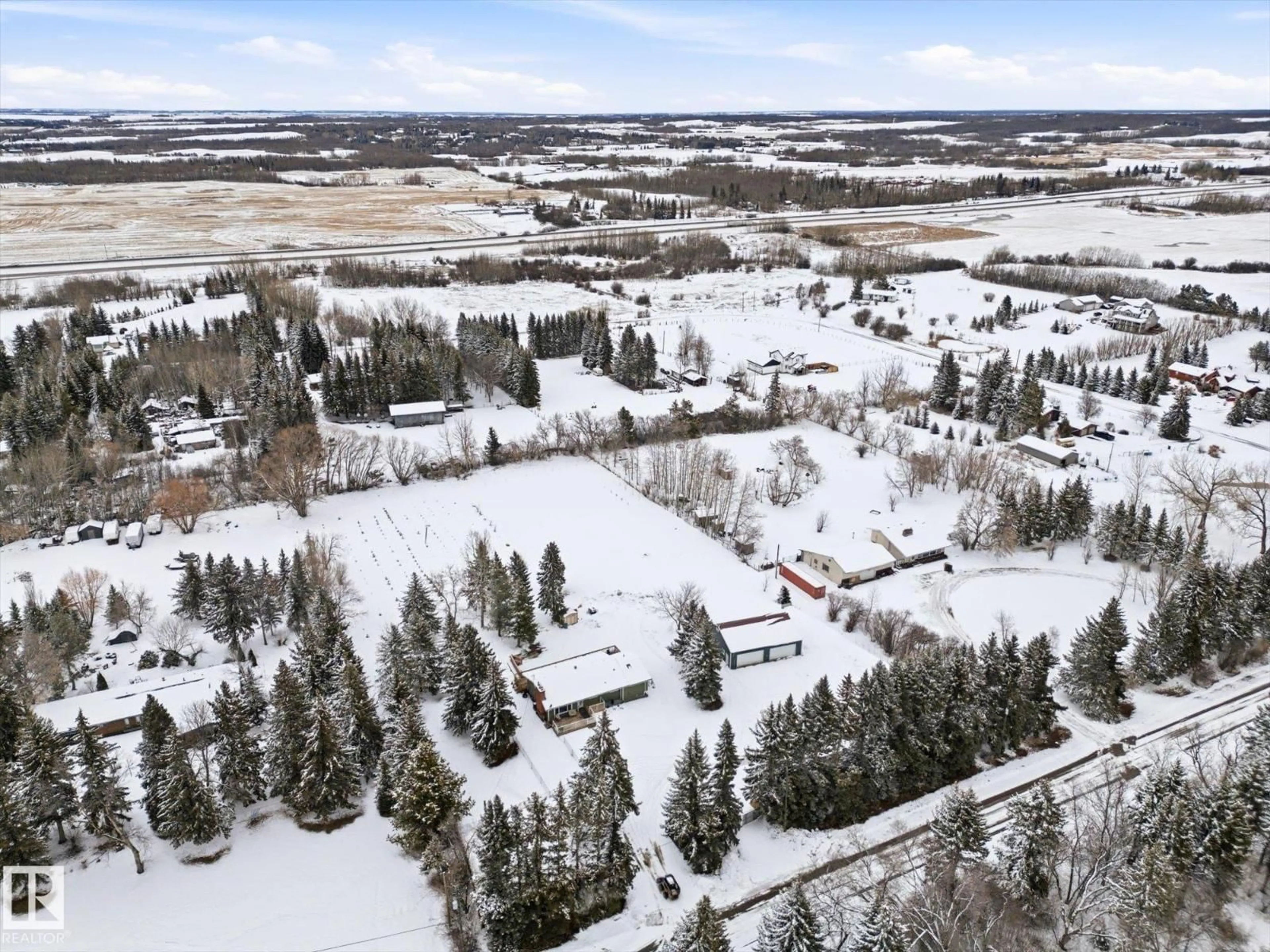 A pic from outside/outdoor area/front of a property/back of a property/a pic from drone, mountain view for 74 53151 RGE ROAD 222, Rural Strathcona County Alberta T8E2J8