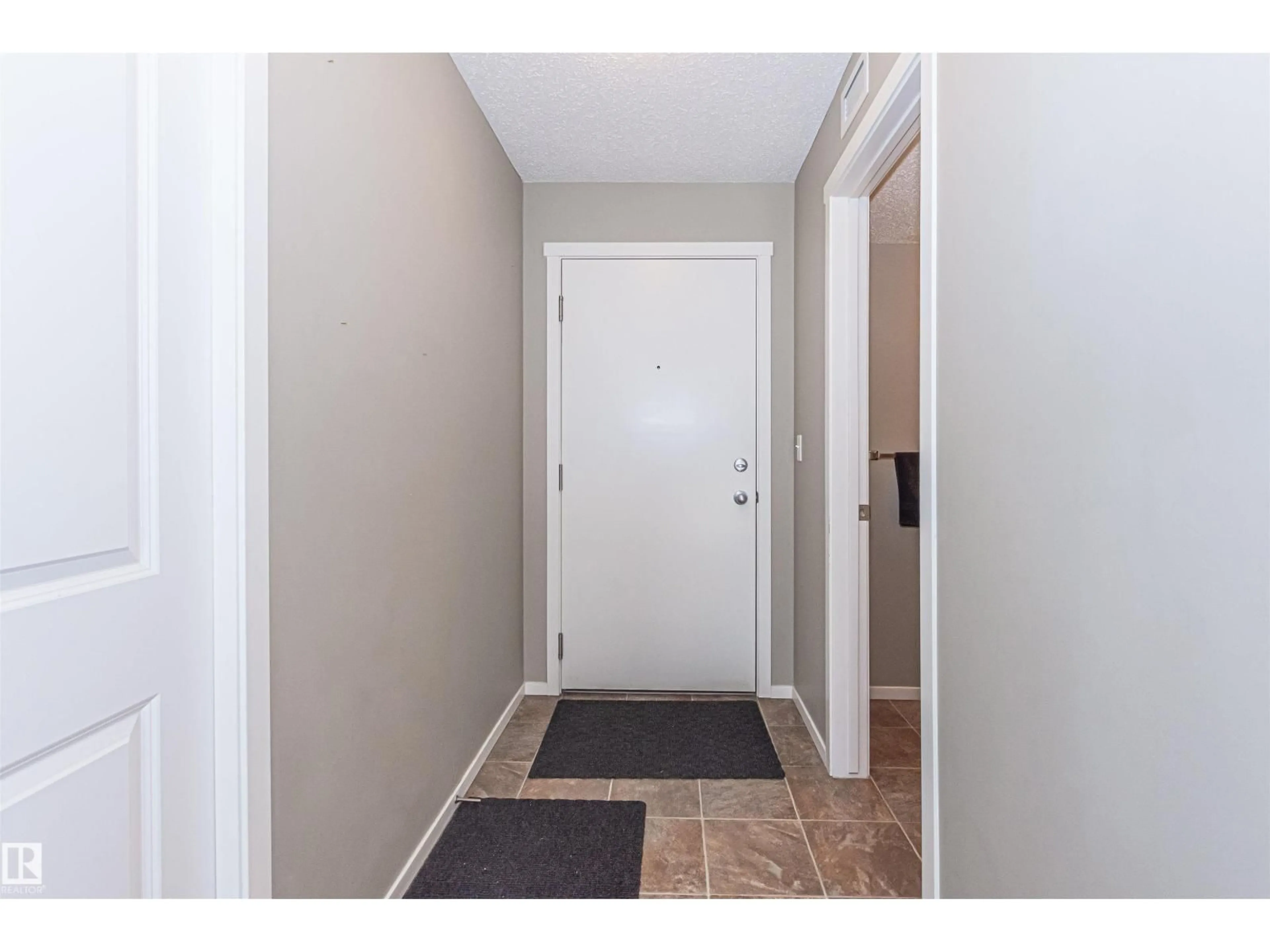 Indoor entryway for #215 - 5816 MULLEN PL, Edmonton Alberta T6R0W3