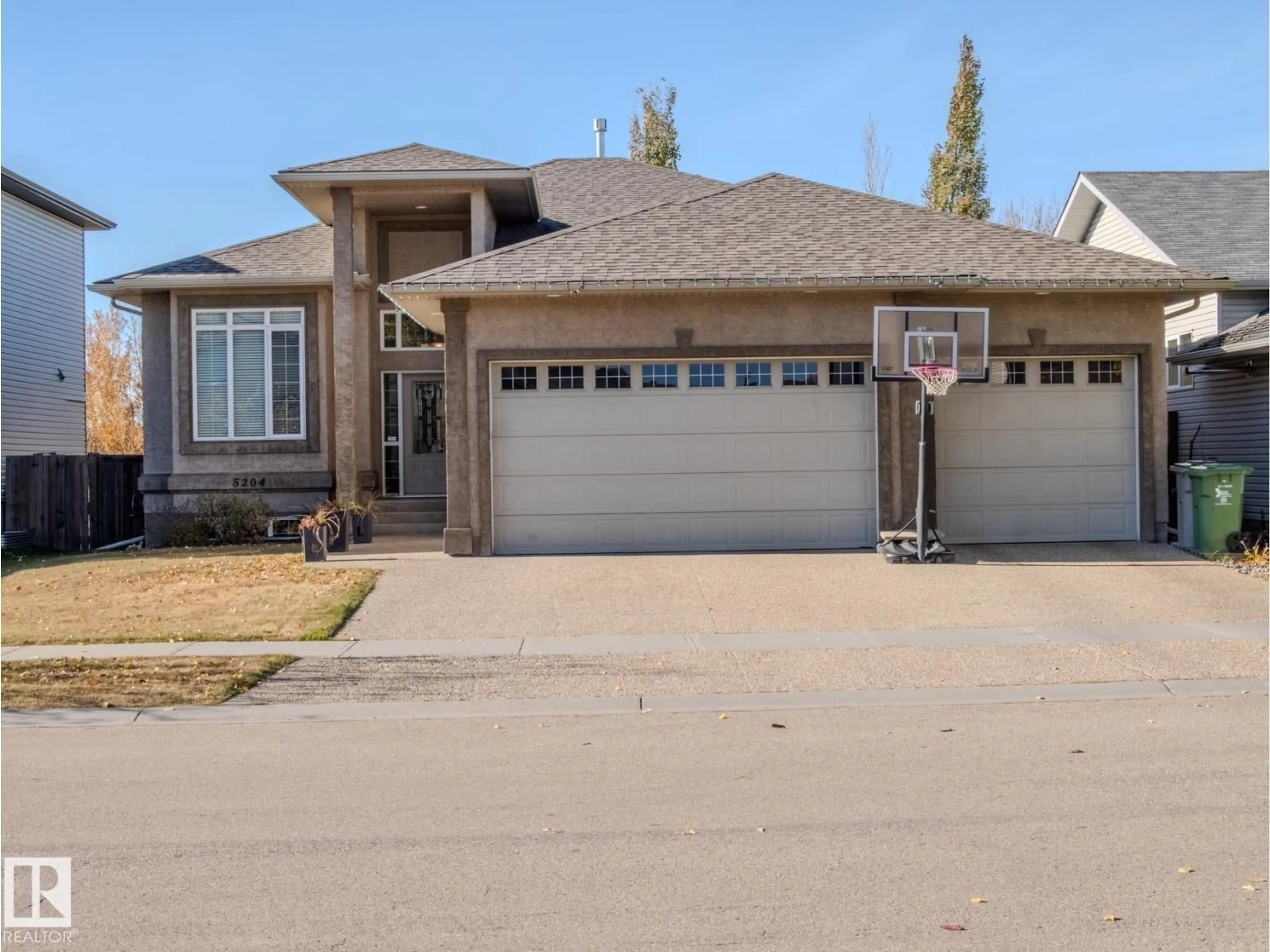 Home with vinyl exterior material, street for 5204 63 ST, Beaumont Alberta T4X1V4