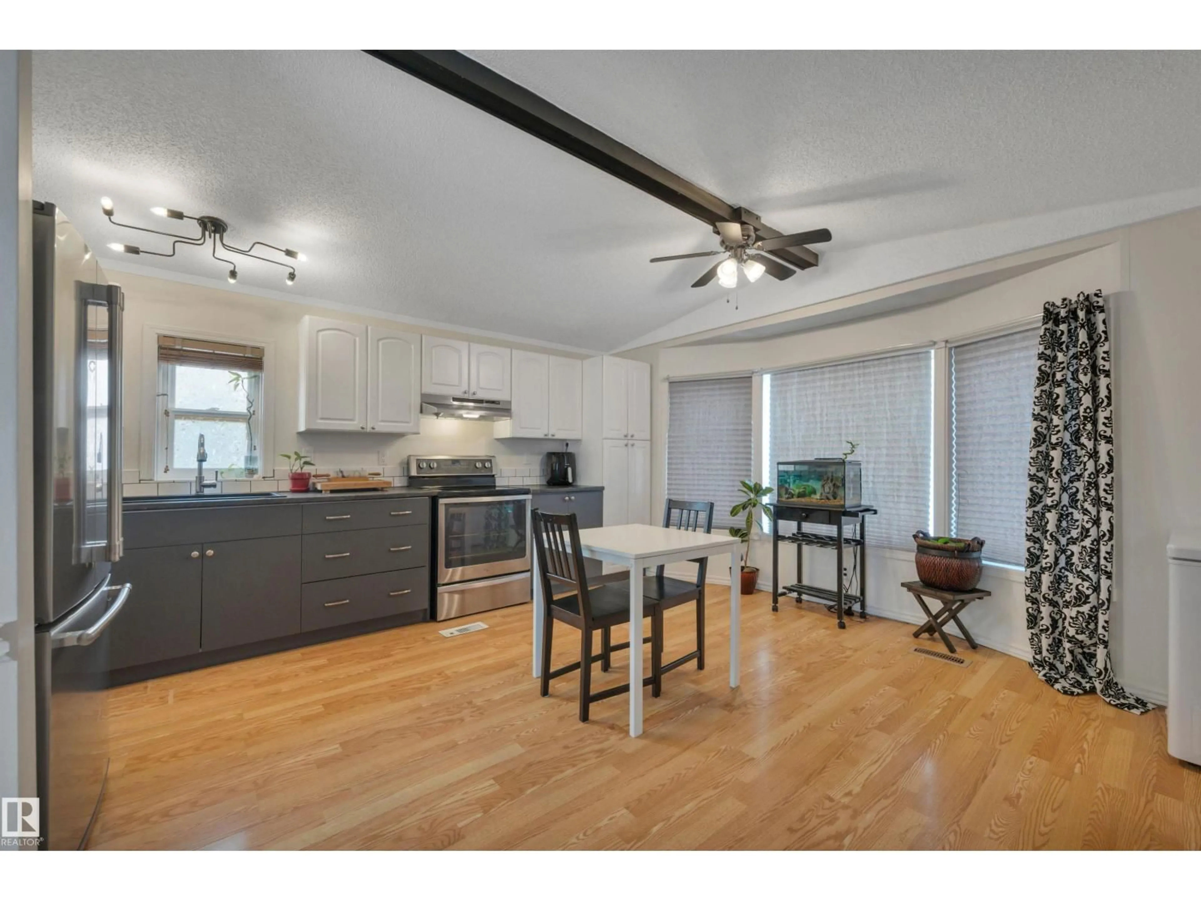 Open concept kitchen, wood/laminate floor for NW NW - 140 EVERGREEN PA, Edmonton Alberta T5Y4M2