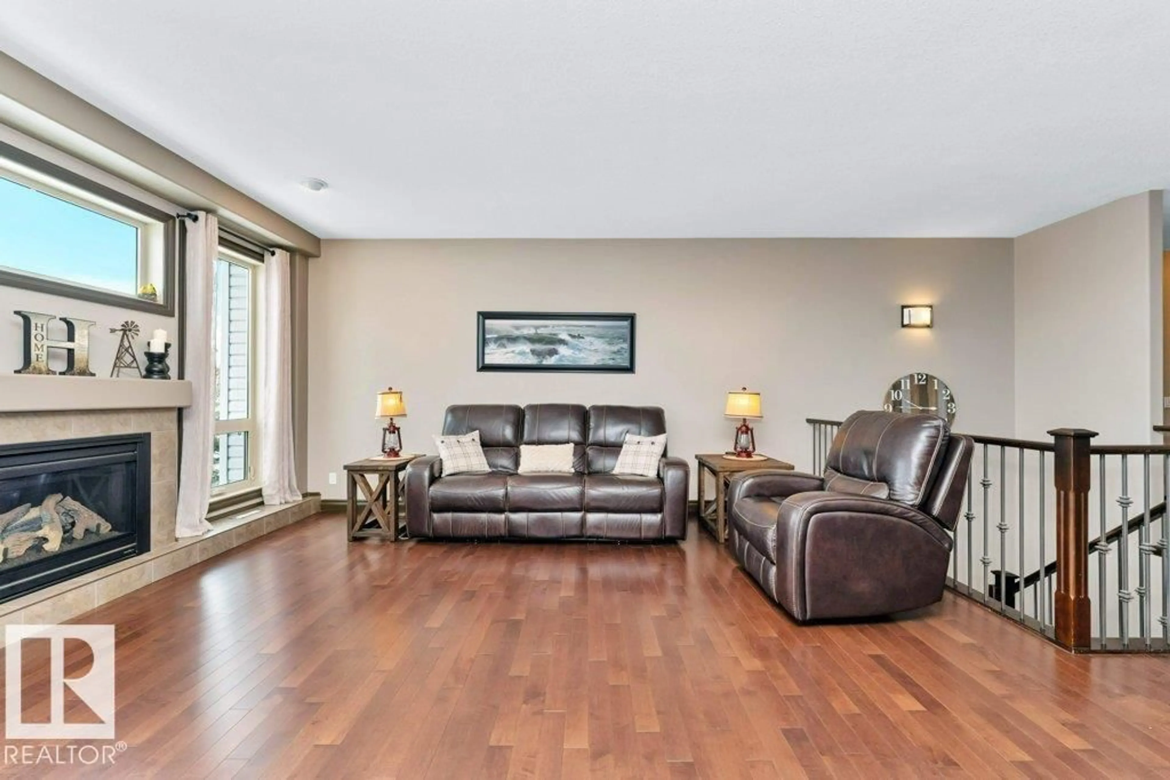 Living room with furniture, wood/laminate floor for 33 HILLCREST PT, Fort Saskatchewan Alberta T8L0A1