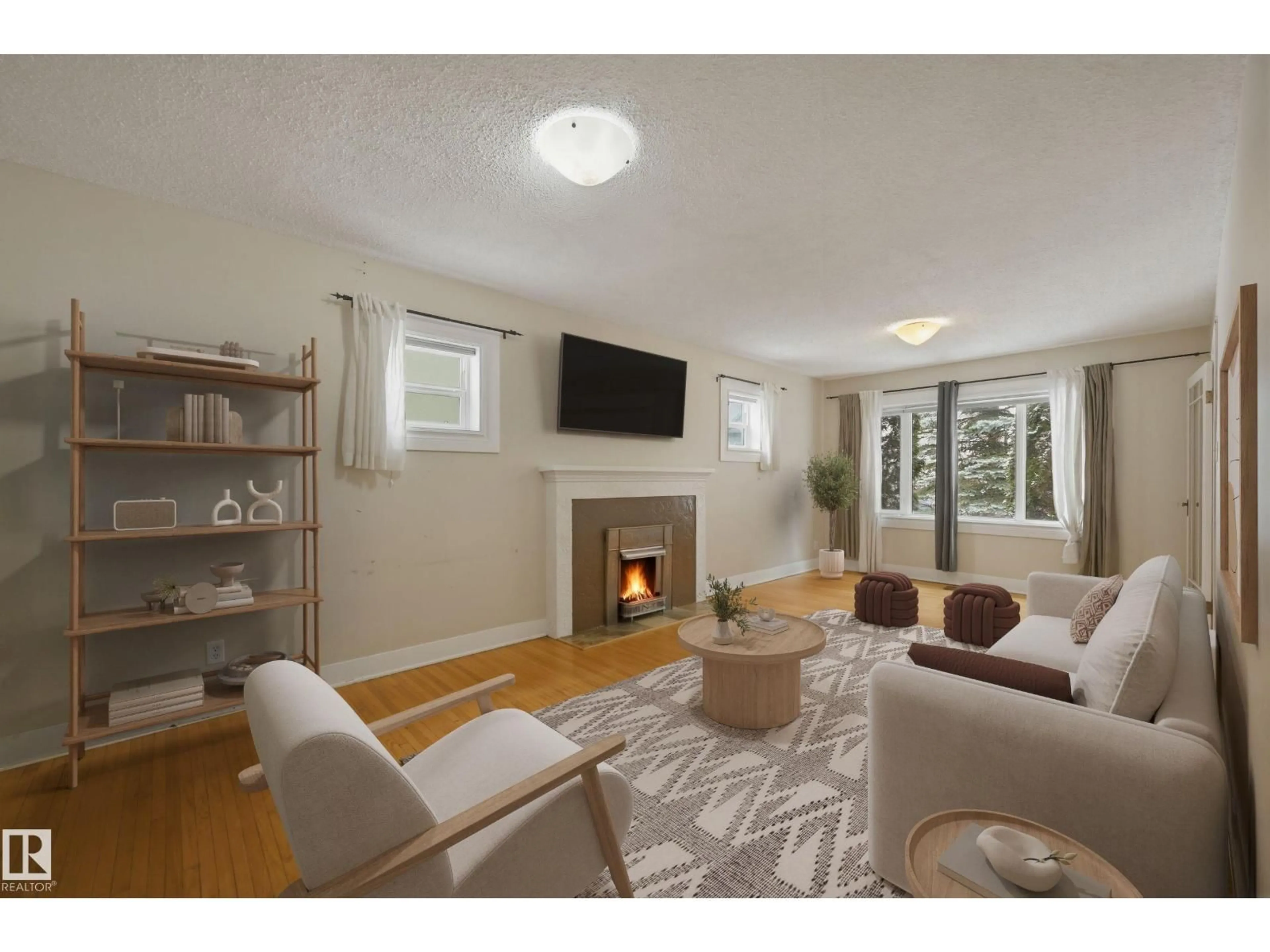 Living room with furniture, wood/laminate floor for 11019 126 ST NW, Edmonton Alberta T5M0P8