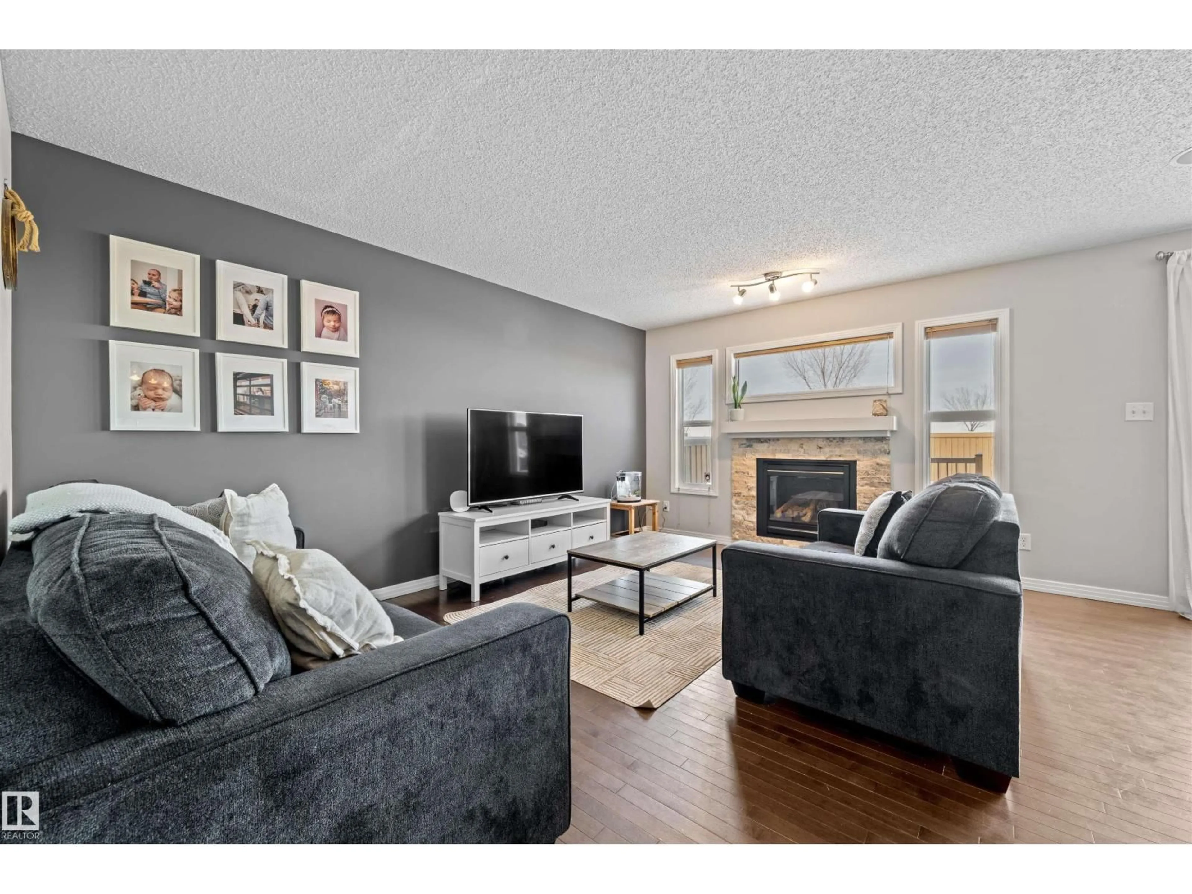 Living room with furniture, wood/laminate floor for NW - 17072 81 ST, Edmonton Alberta T5Z0E1