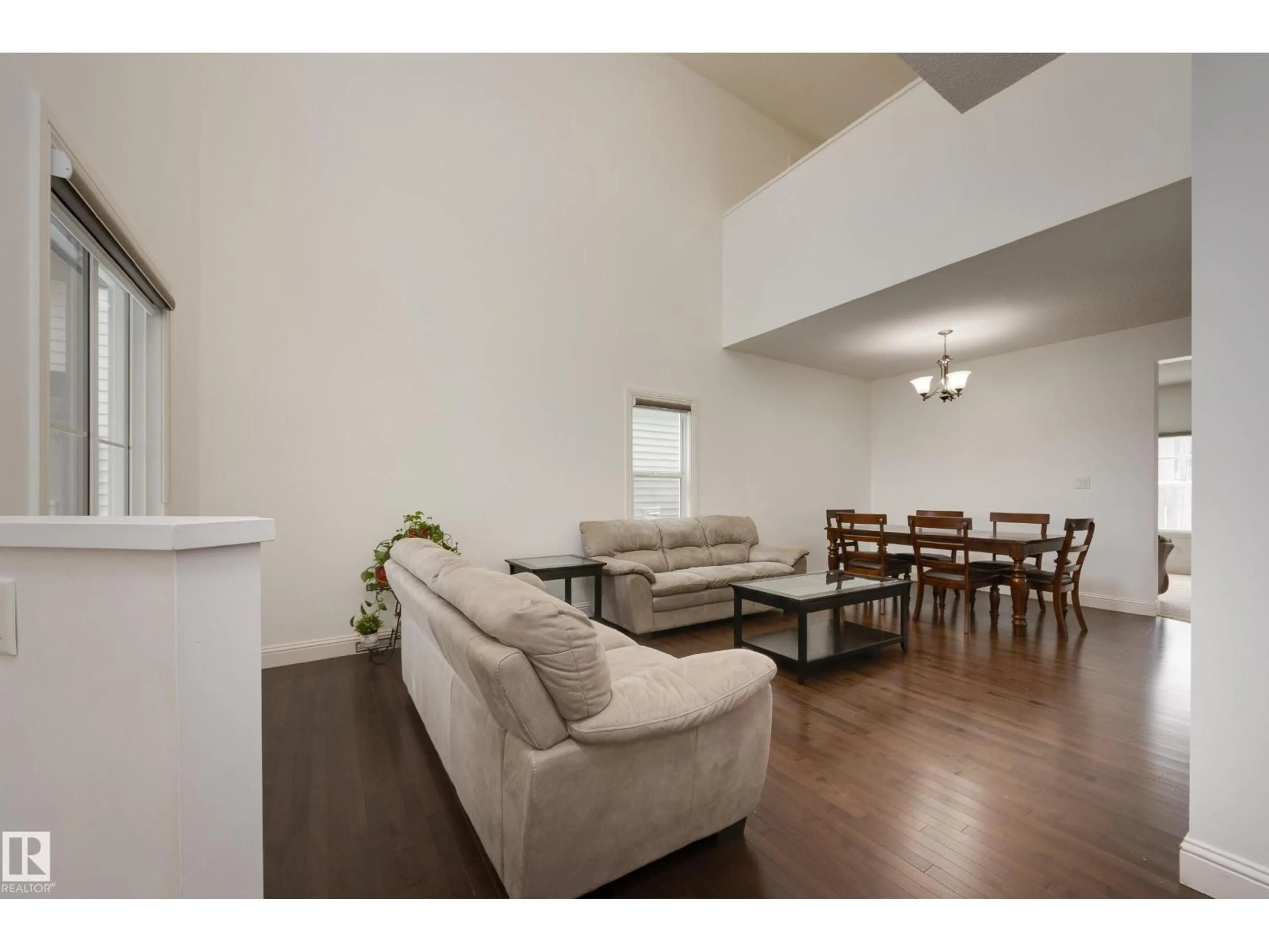 Living room with furniture, wood/laminate floor for 6131 10 AV, Edmonton Alberta T6X0M3