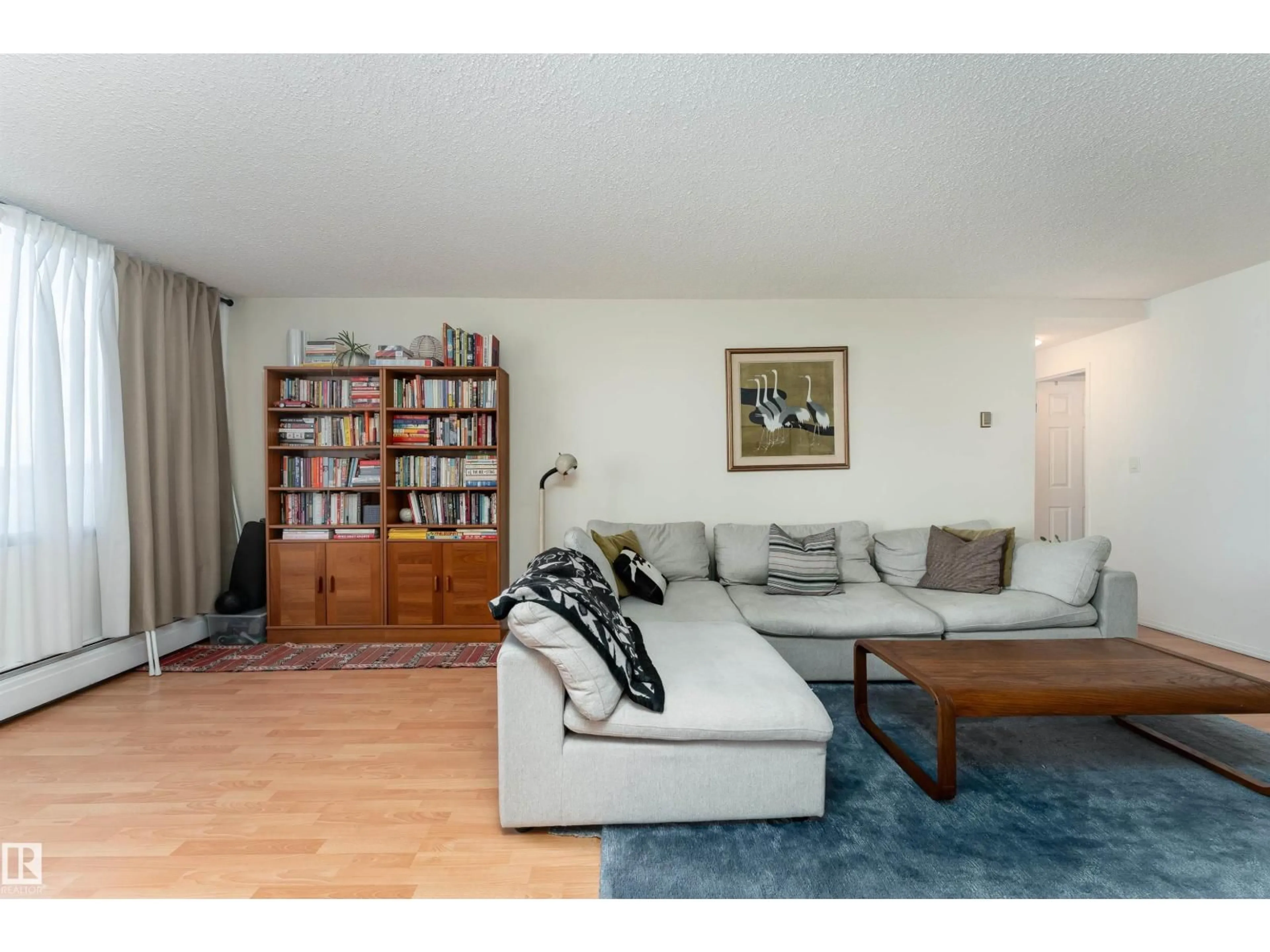 Living room with furniture, wood/laminate floor for #805 - 9808 103 ST, Edmonton Alberta T5K2G4