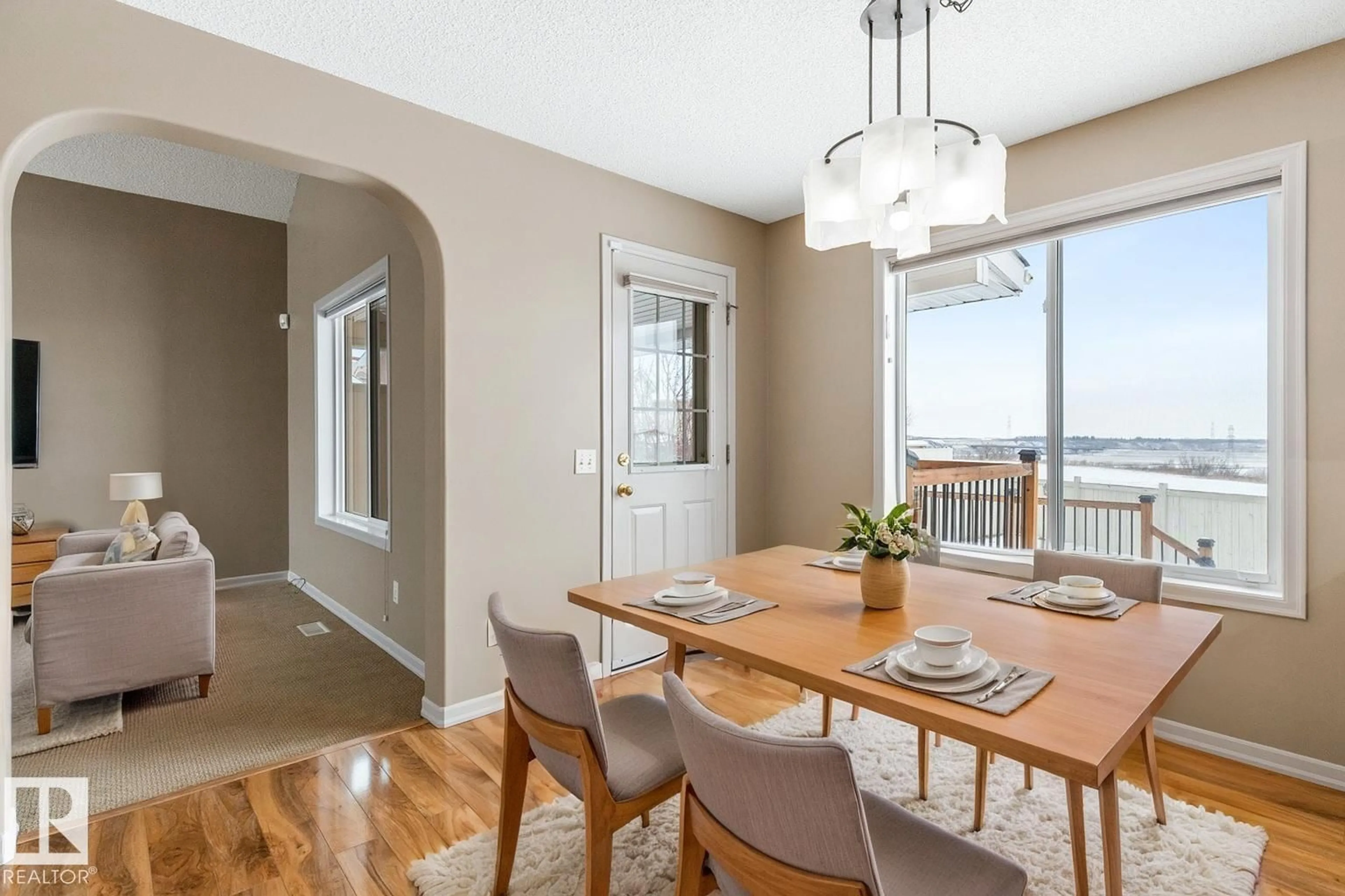 Dining room, wood/laminate floor for 235 RIVER PT, Edmonton Alberta T5A4Z2