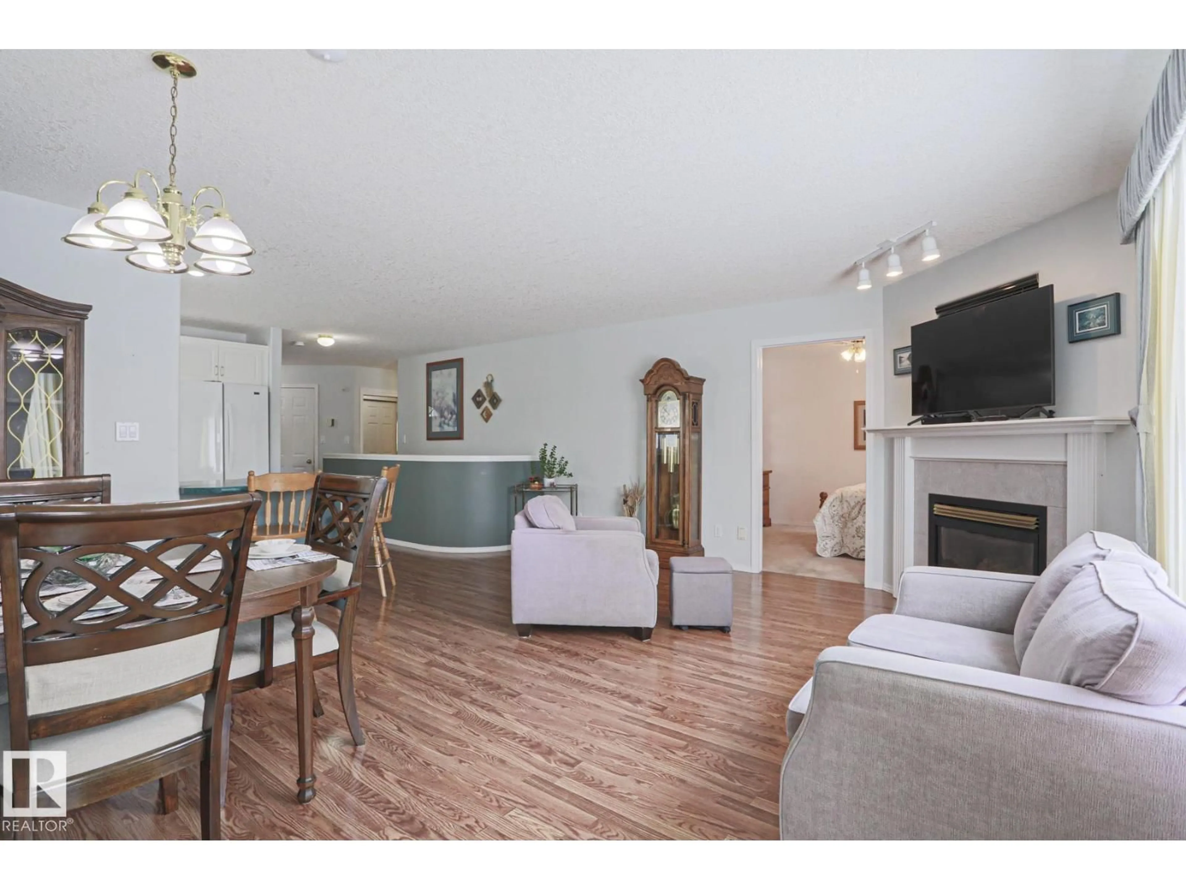 Living room with furniture, wood/laminate floor for VG - 116 MAISONETTE, Leduc Alberta T9E6T1