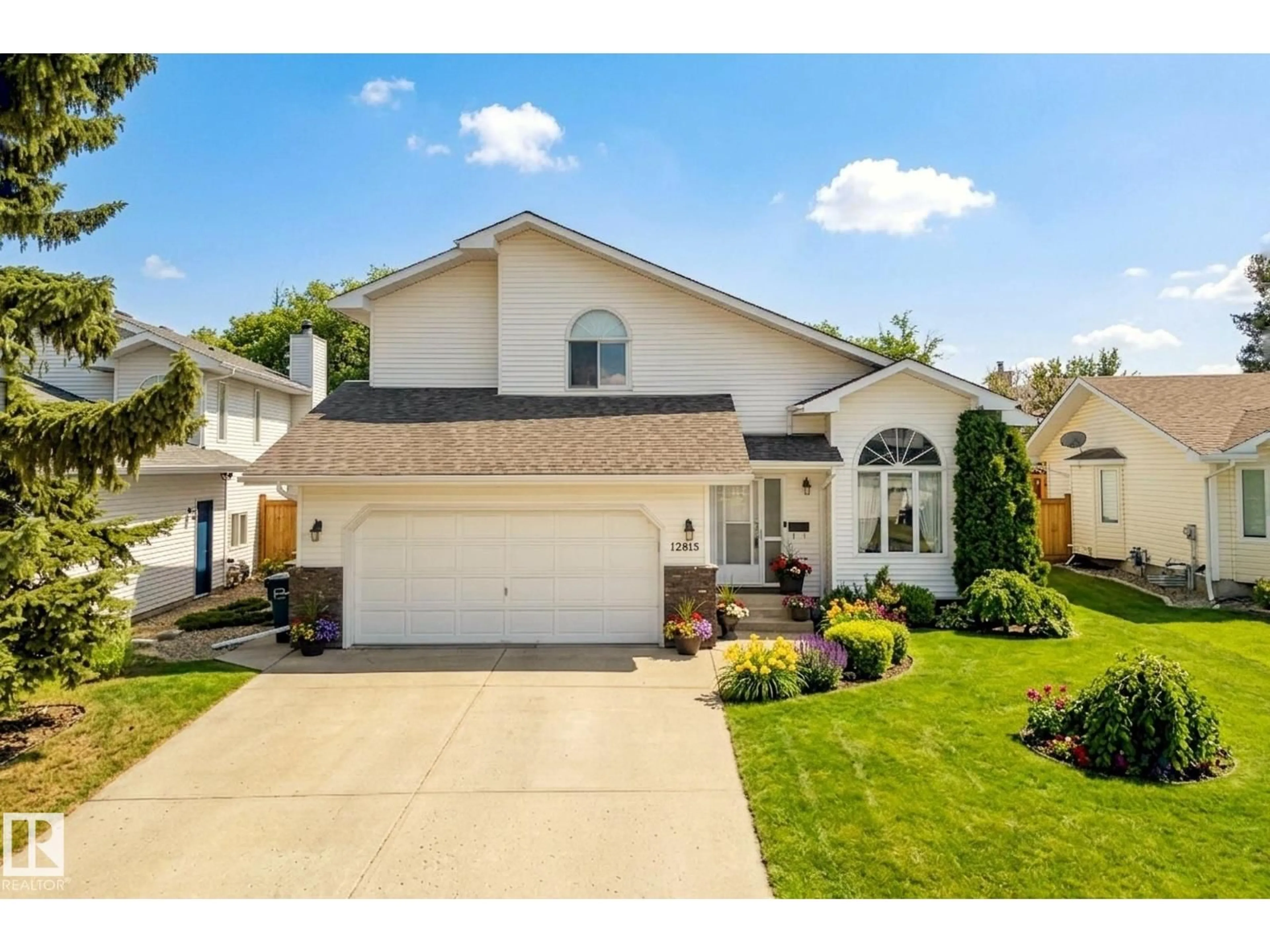 Home with vinyl exterior material, street for 12815 156 AV, Edmonton Alberta T6V1A6