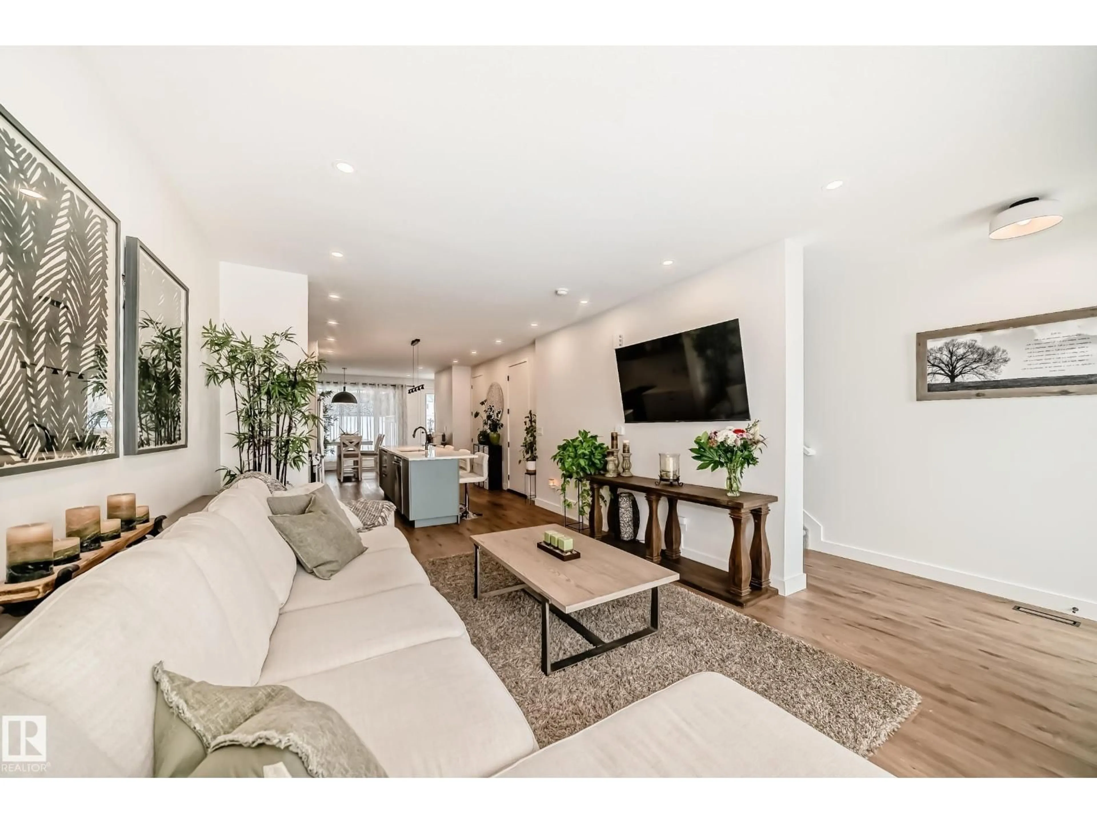 Living room with furniture, unknown for NW - 10936 117 ST, Edmonton Alberta T5H3N6