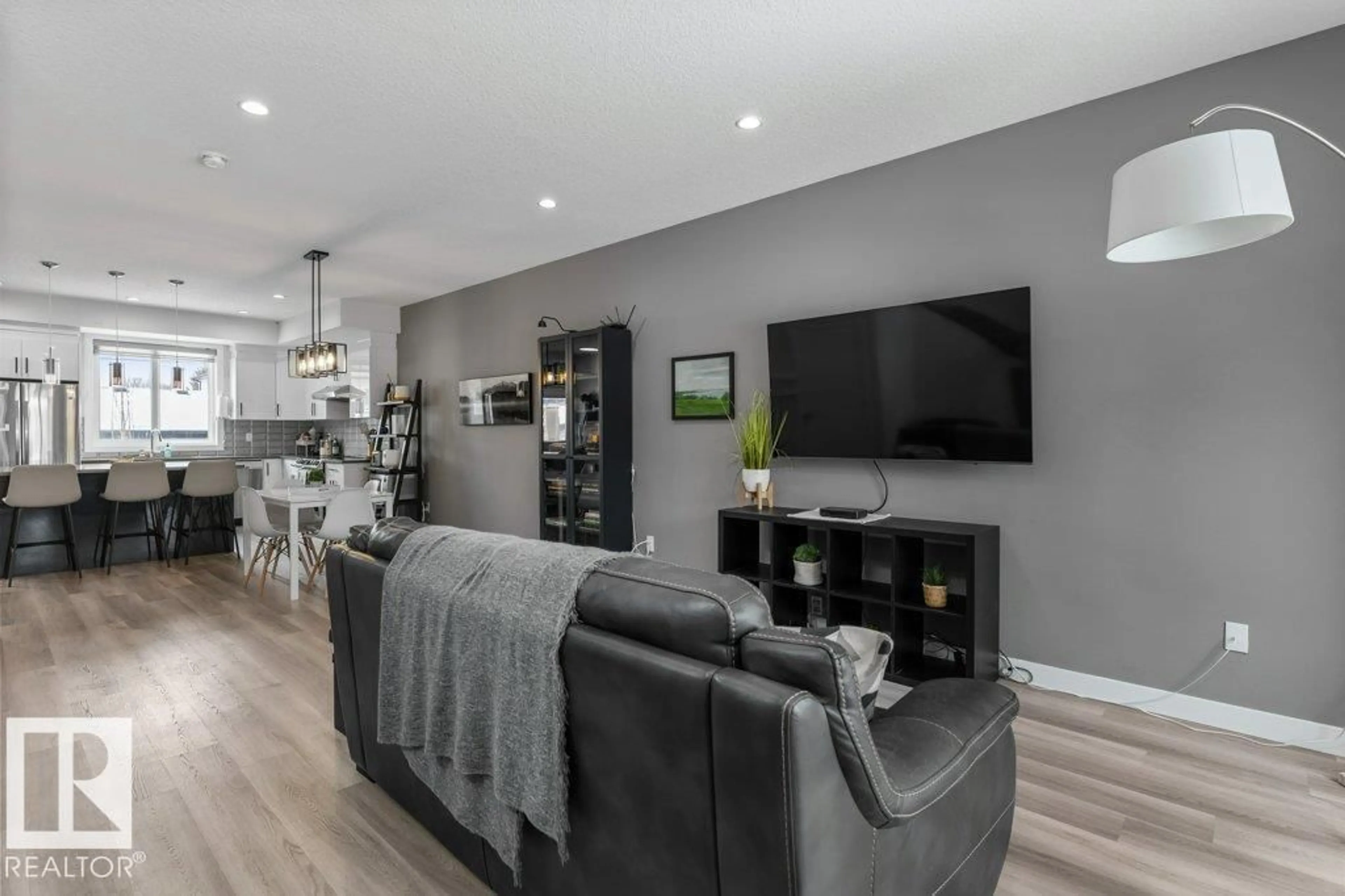 Living room with furniture, wood/laminate floor for 11029 150 ST, Edmonton Alberta T5P1R9
