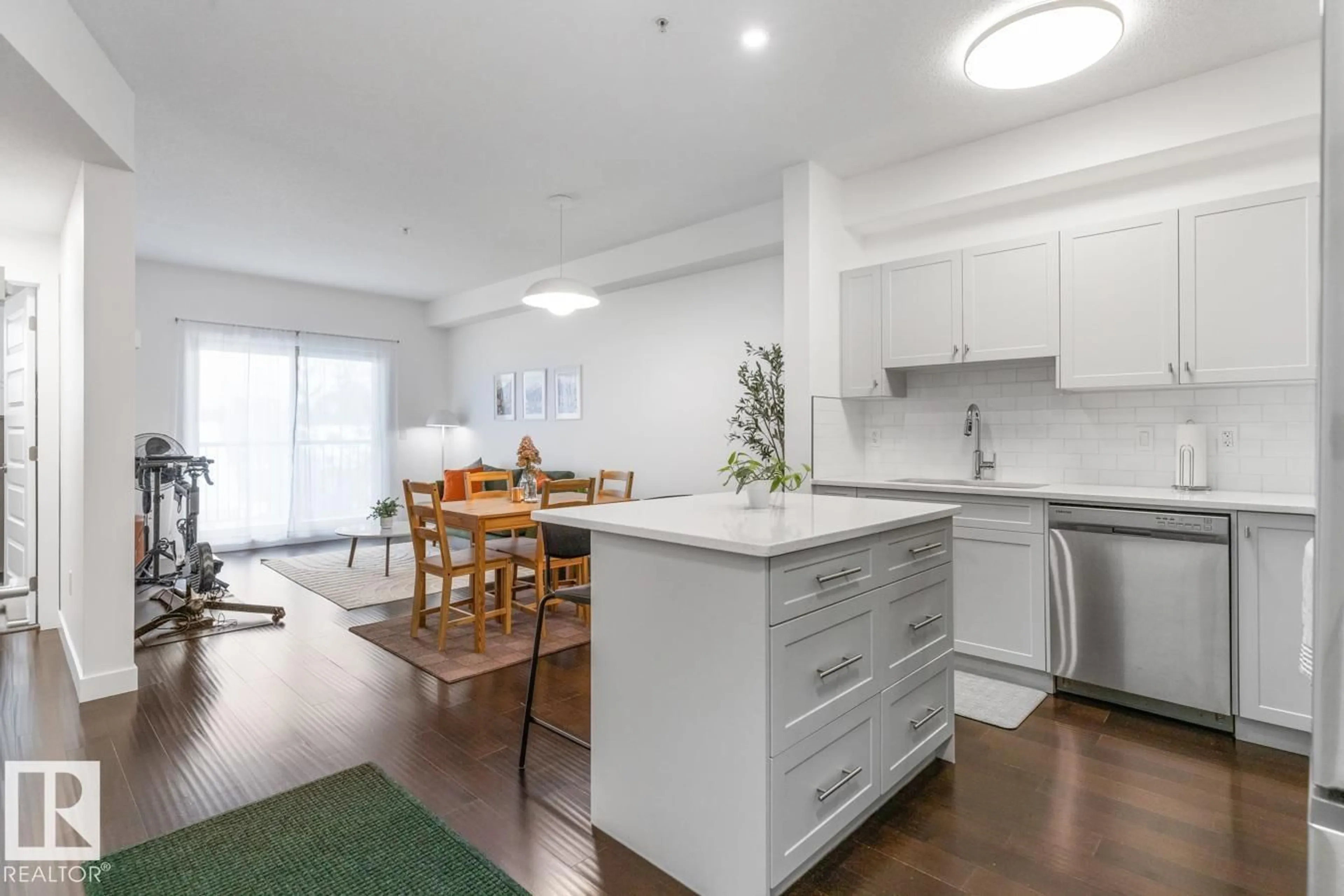 Open concept kitchen, wood/laminate floor for 307 - 8730 82 AV, Edmonton Alberta T6C0Z1