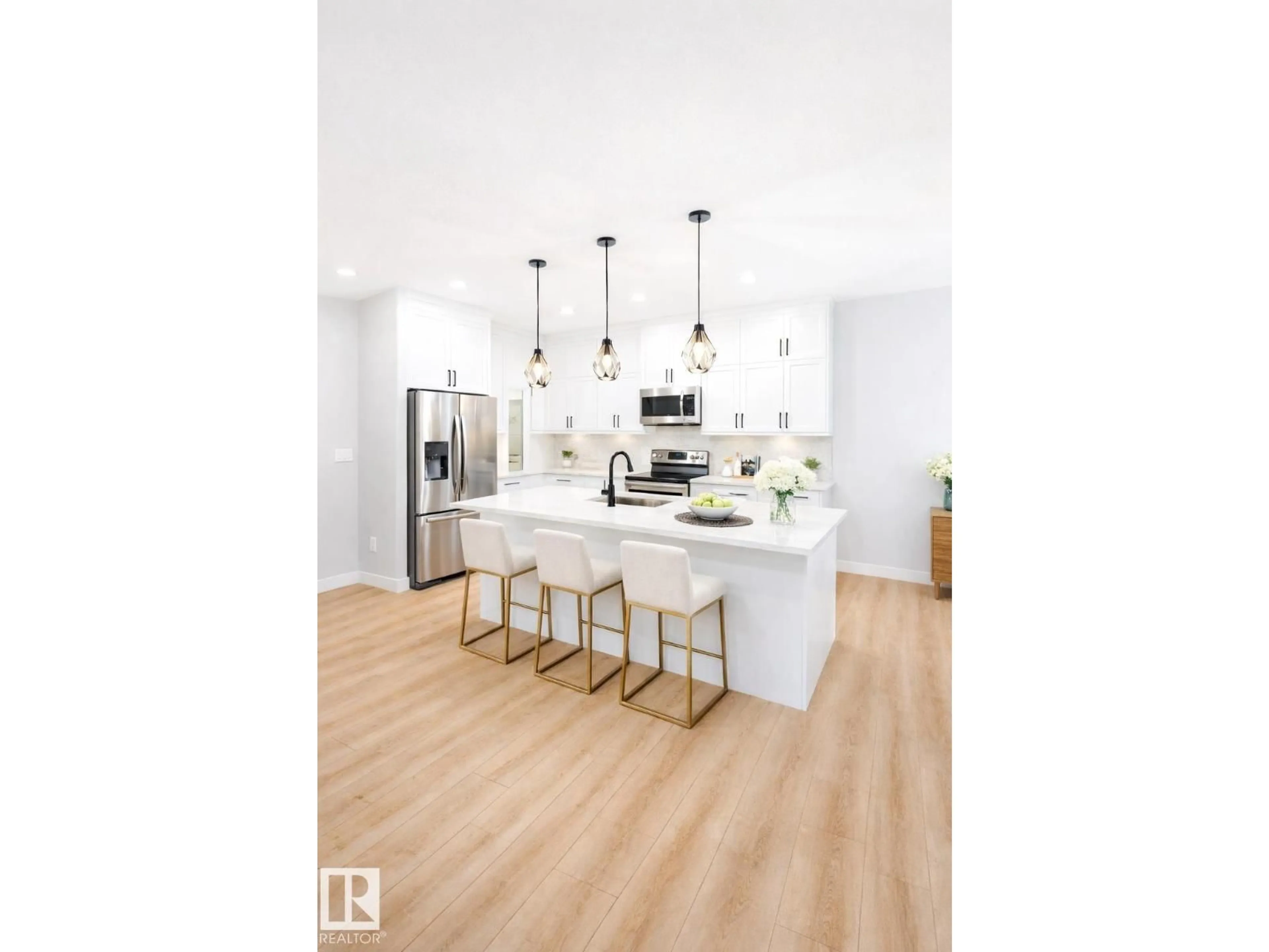 Open concept kitchen, wood/laminate floor for 10707 98 ST, Morinville Alberta T8R2R2