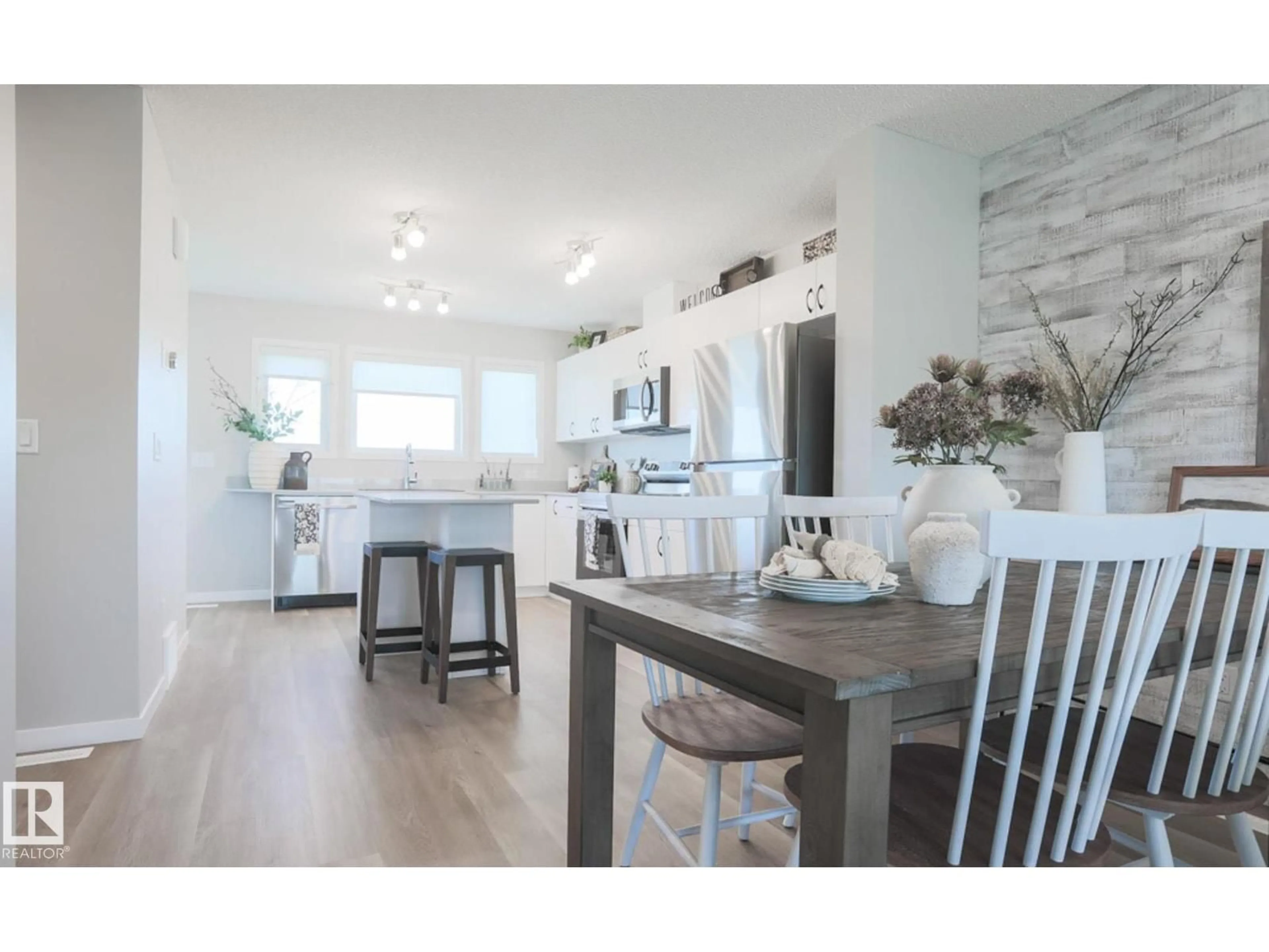 Open concept kitchen, wood/laminate floor for 123 SERENO LN, Fort Saskatchewan Alberta T8L0Z9