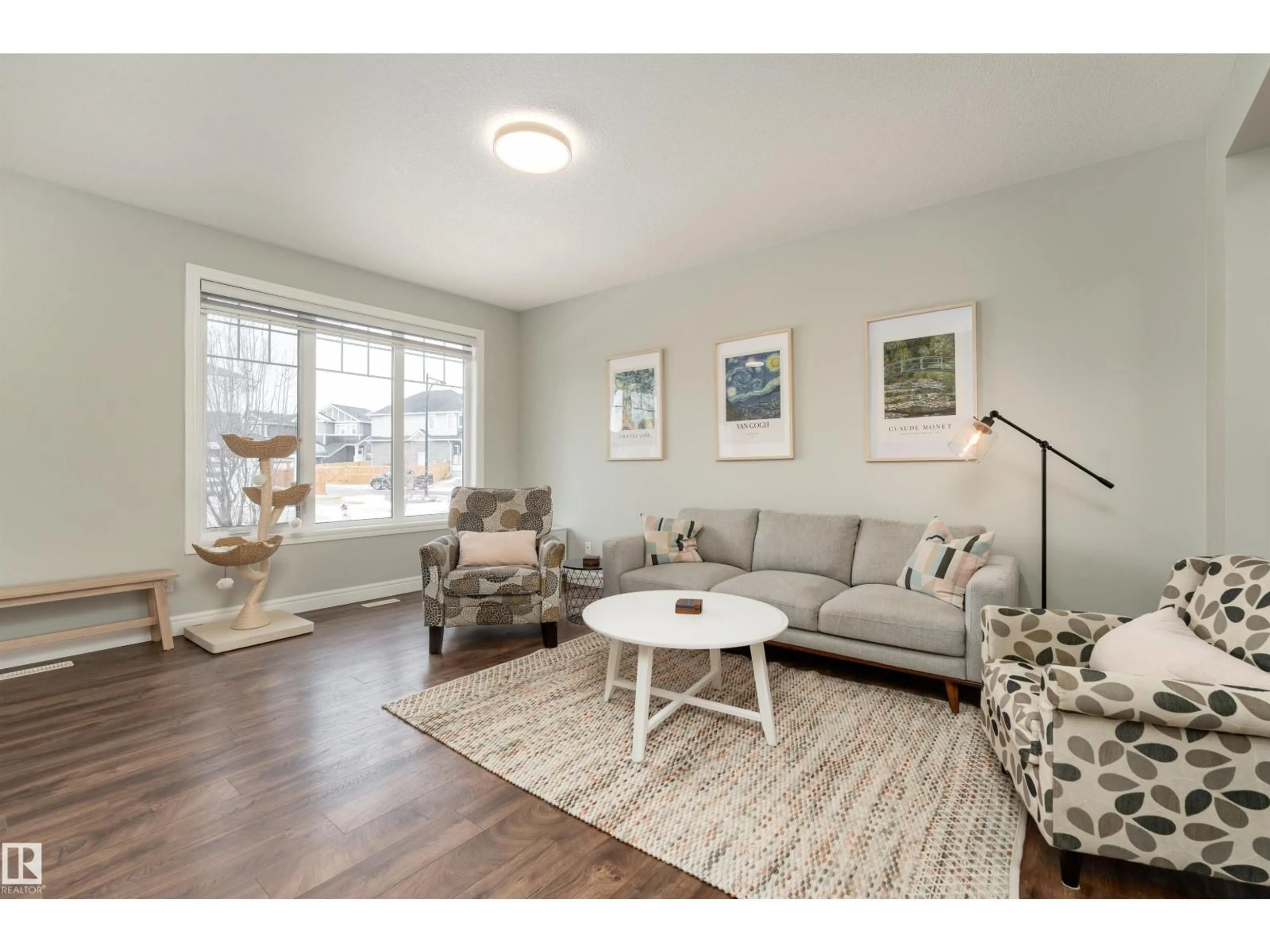 Living room with furniture, wood/laminate floor for 6741 ELSTON LN, Edmonton Alberta T6M0T5