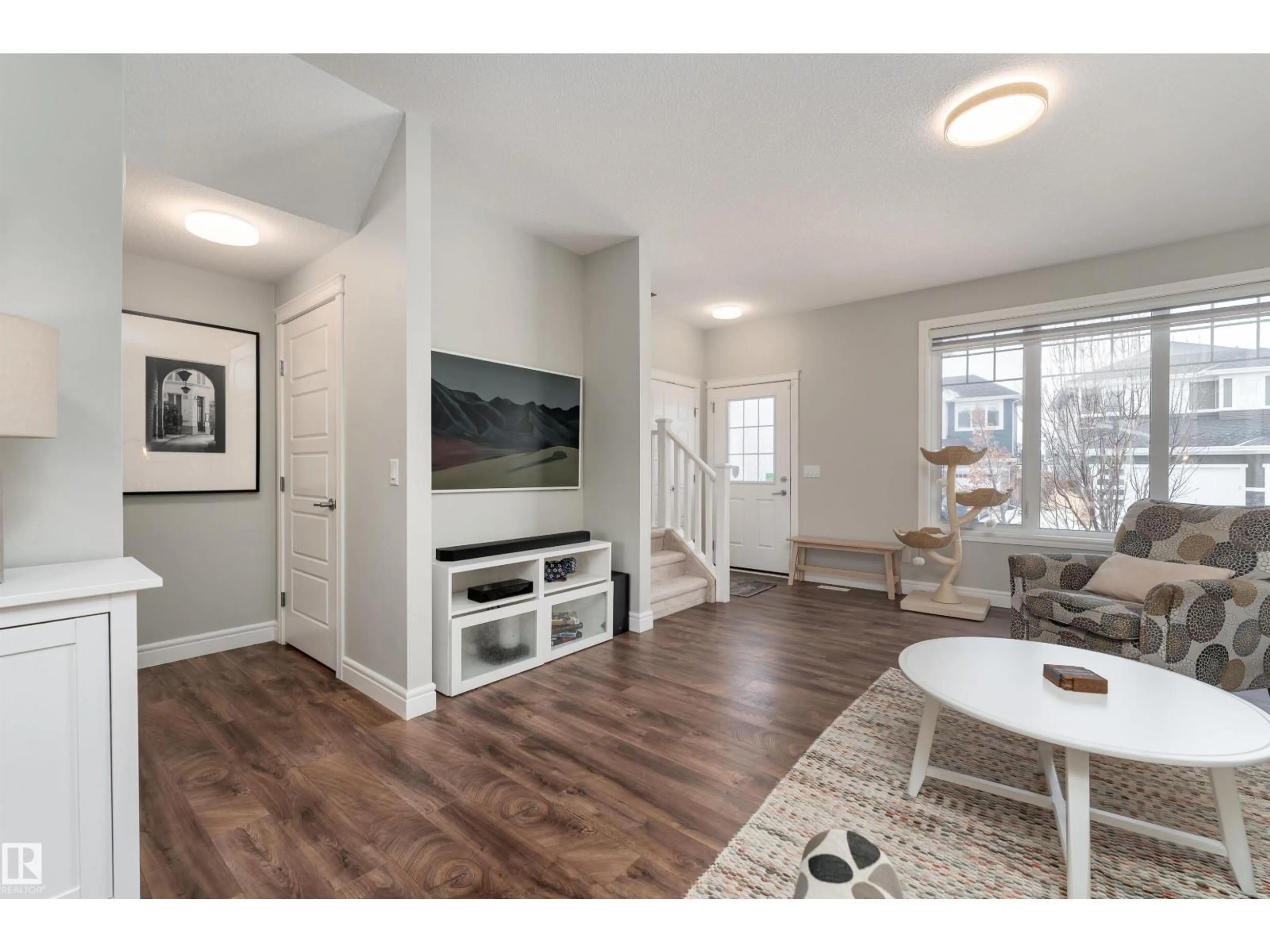 Living room with furniture, wood/laminate floor for 6741 ELSTON LN, Edmonton Alberta T6M0T5