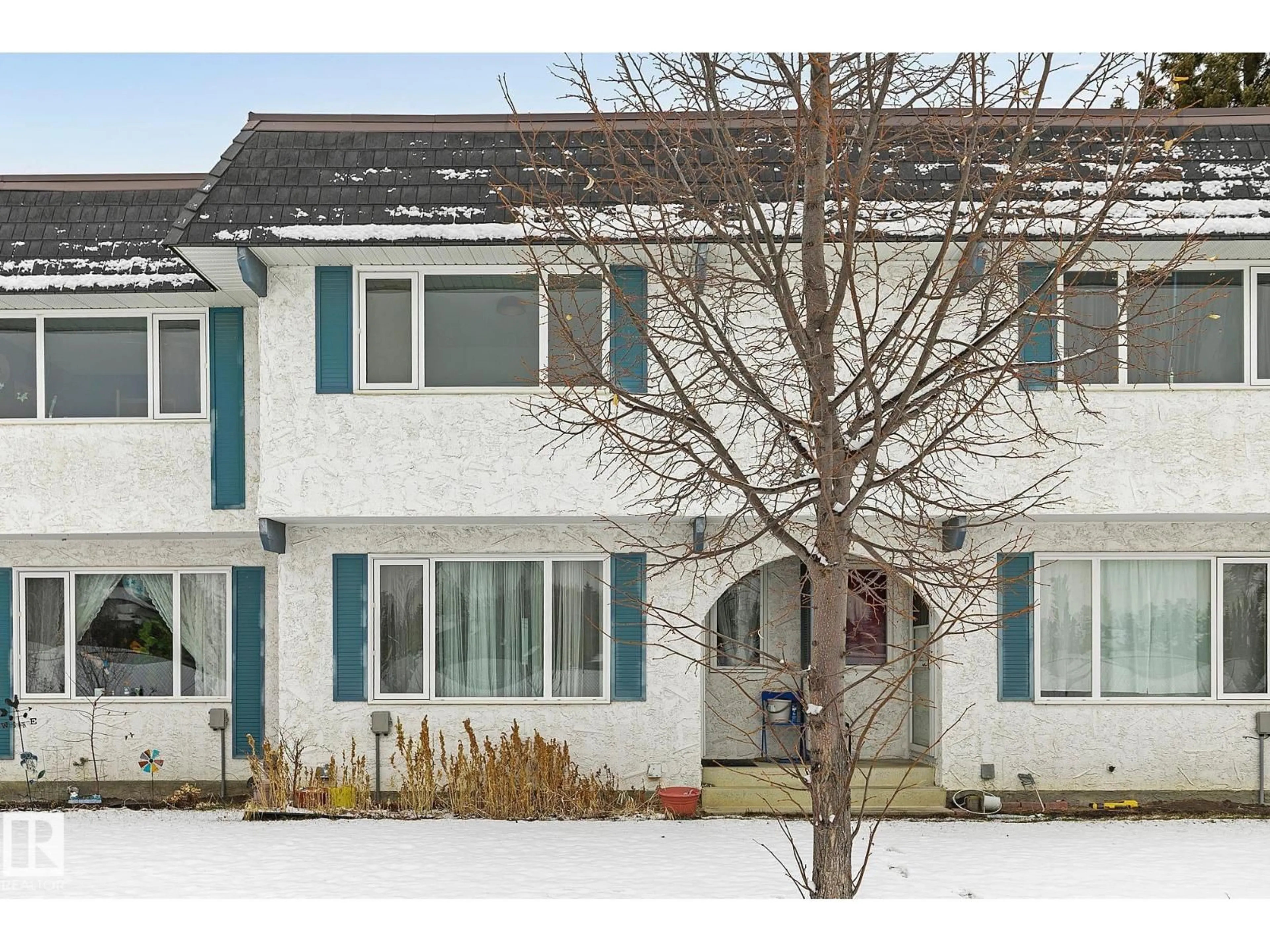 Home with vinyl exterior material, street for 11365 22 AV, Edmonton Alberta T6J4V8