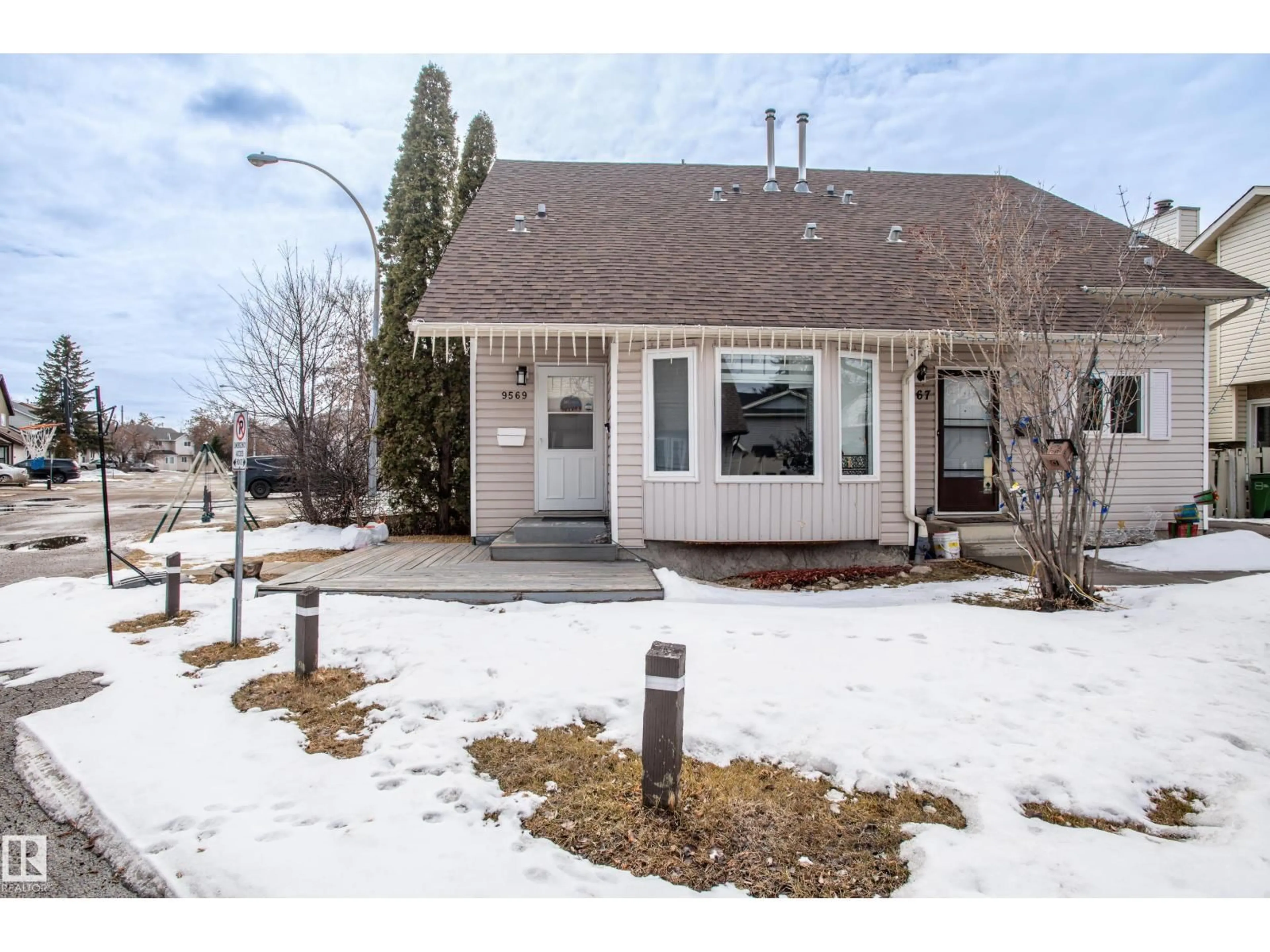 Home with vinyl exterior material, street for NW - 9569 180A ST, Edmonton Alberta T5T2Z4