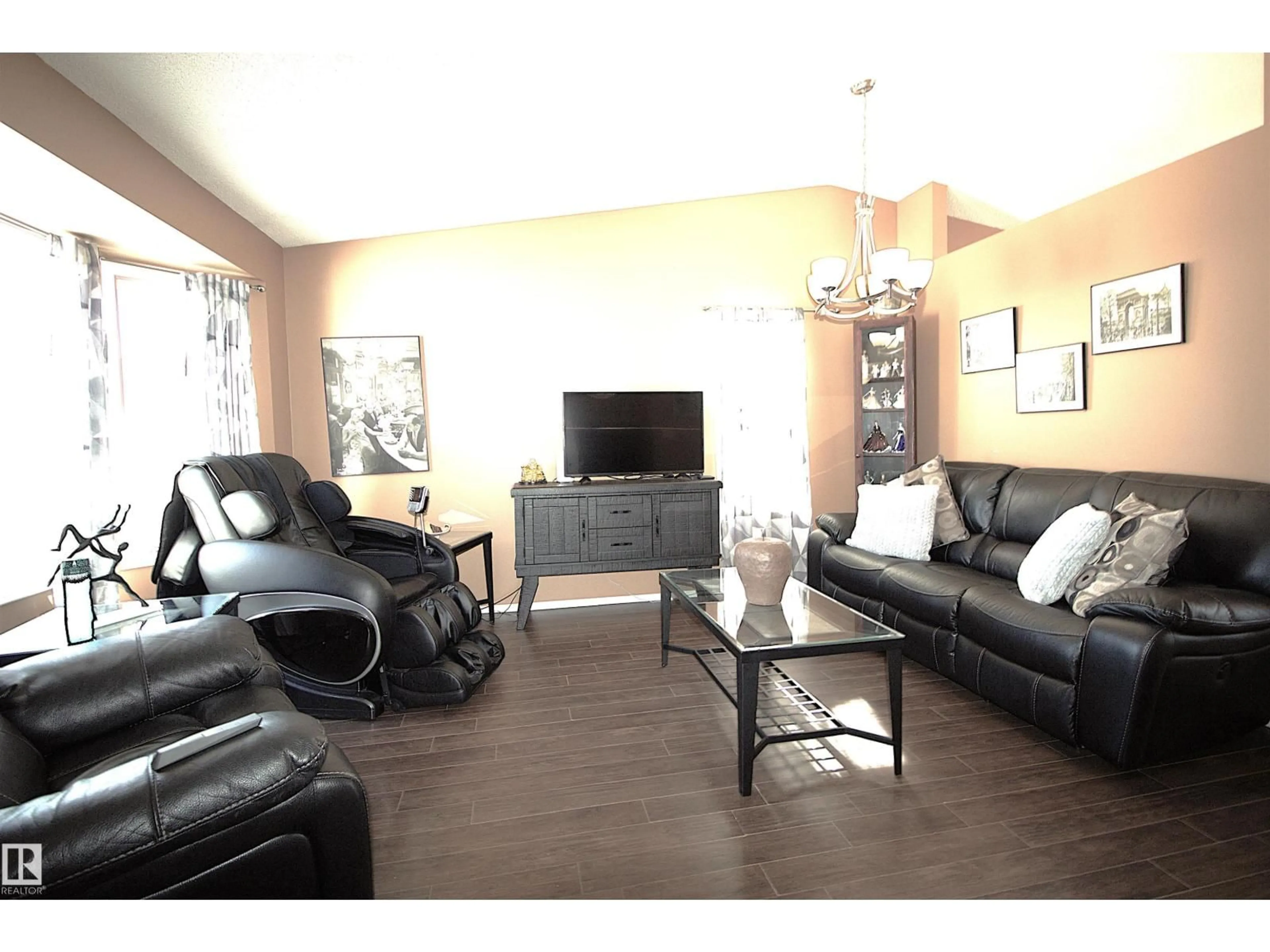 Living room with furniture, wood/laminate floor for 9347 175 AV, Edmonton Alberta T5Z2C8