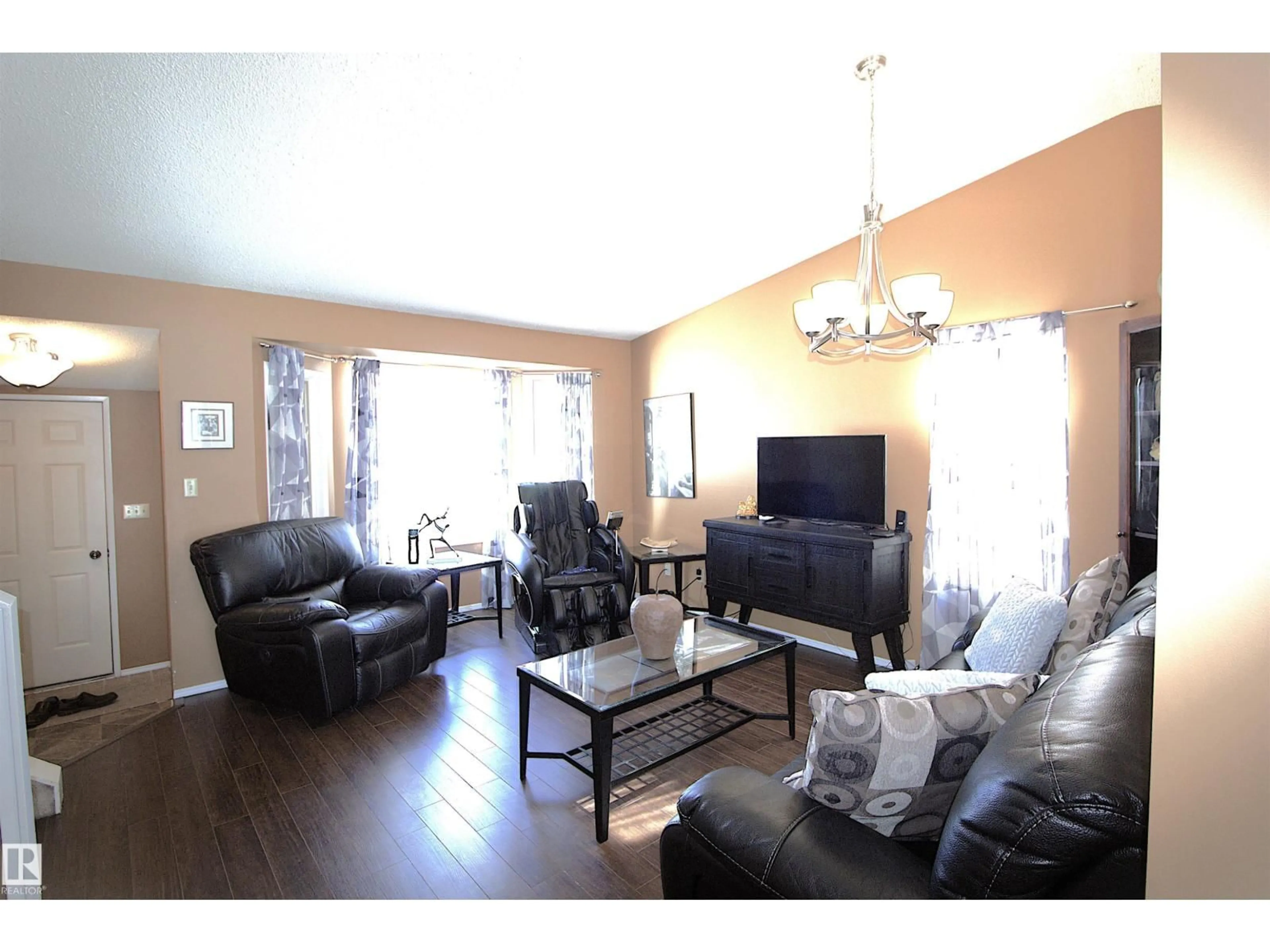 Living room with furniture, wood/laminate floor for 9347 175 AV, Edmonton Alberta T5Z2C8
