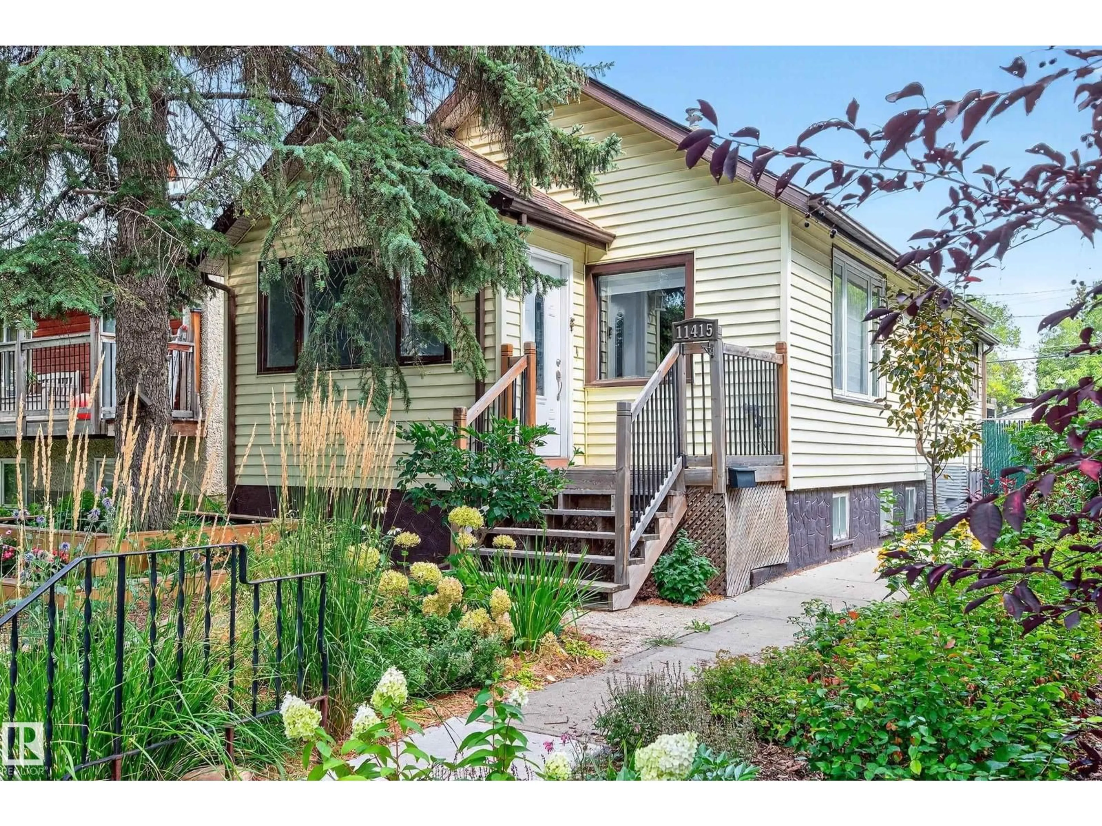 Home with vinyl exterior material, street for NW - 11415 68 ST, Edmonton Alberta T5B1N9