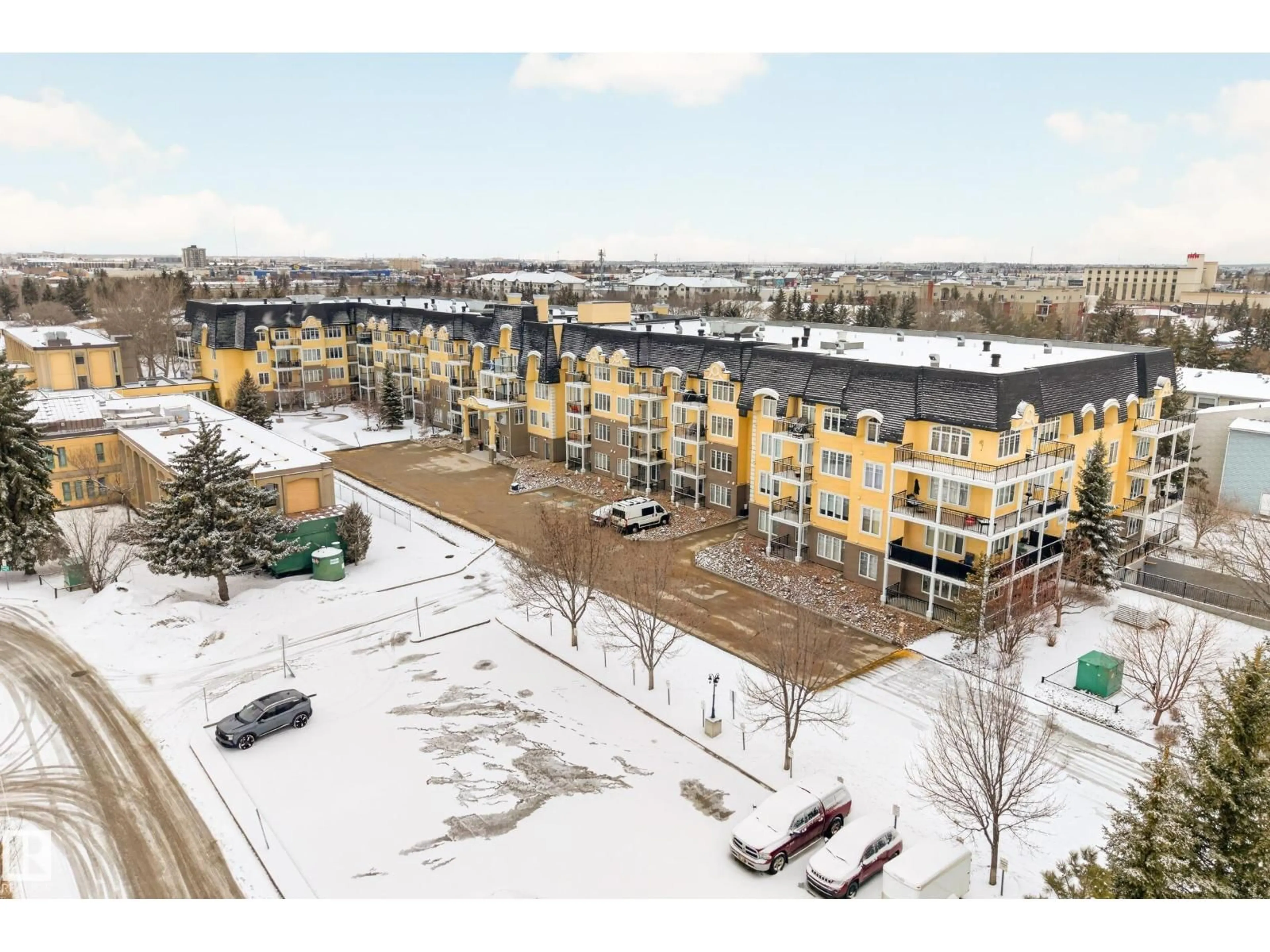 A pic from outside/outdoor area/front of a property/back of a property/a pic from drone, mountain view for #318 - 9820 165 ST, Edmonton Alberta T5P0N2