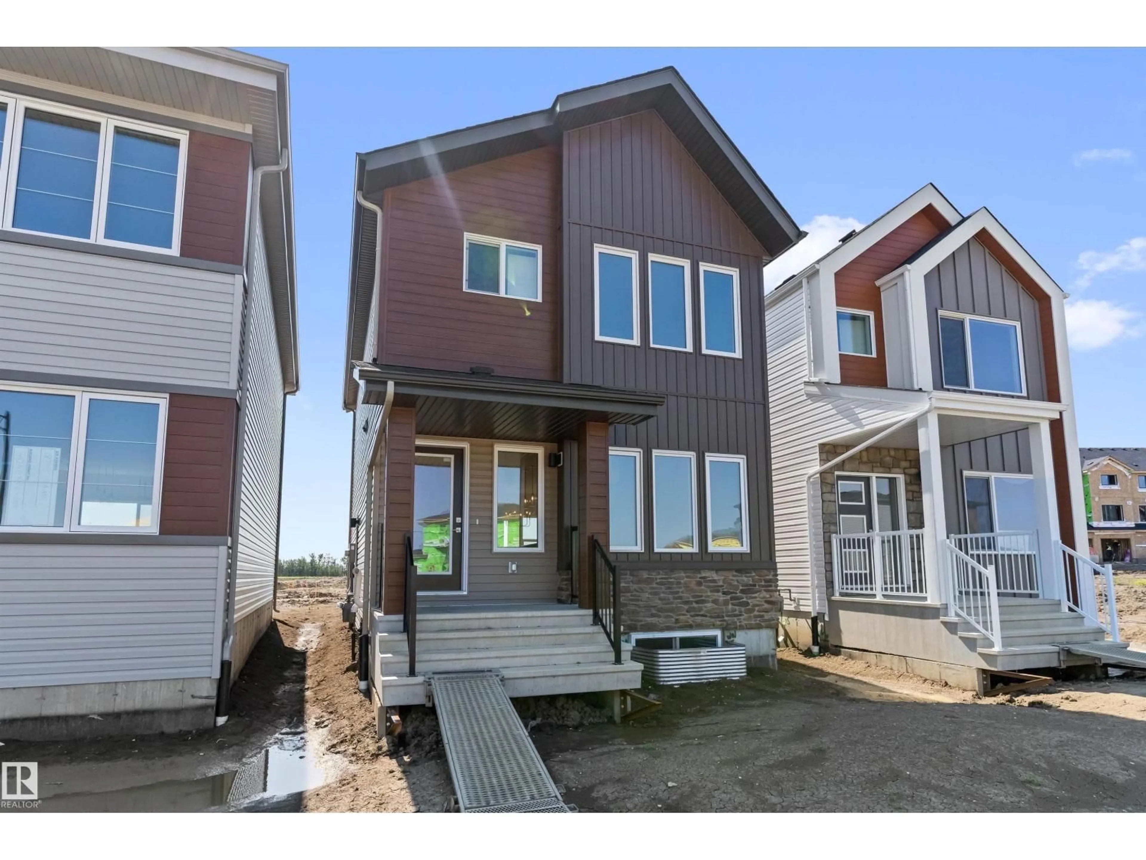 Home with vinyl exterior material, street for 18713 18A AV, Edmonton Alberta T6M0X8
