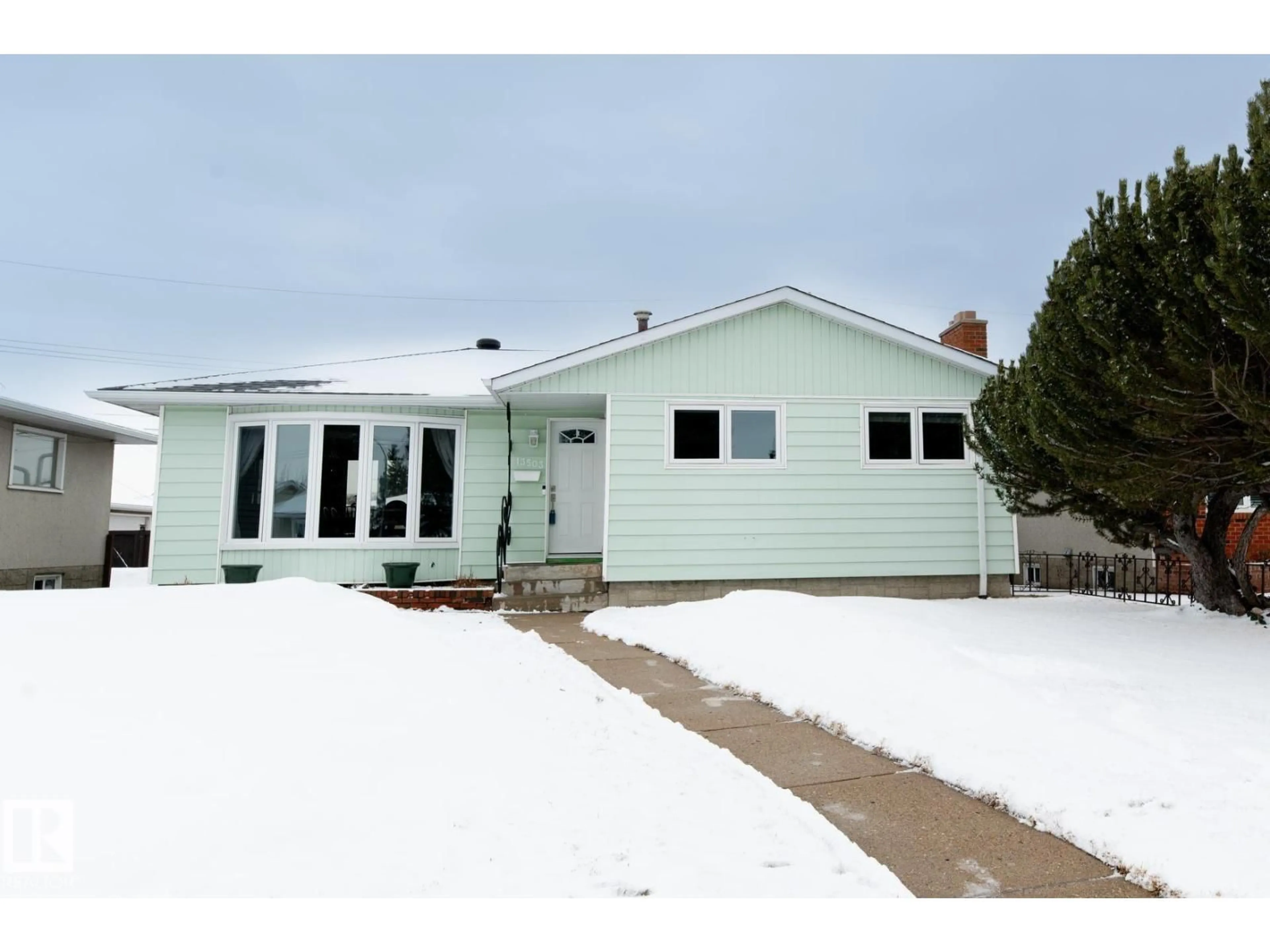 Home with vinyl exterior material, street for NW - 13503 111 ST, Edmonton Alberta T5E4Z7