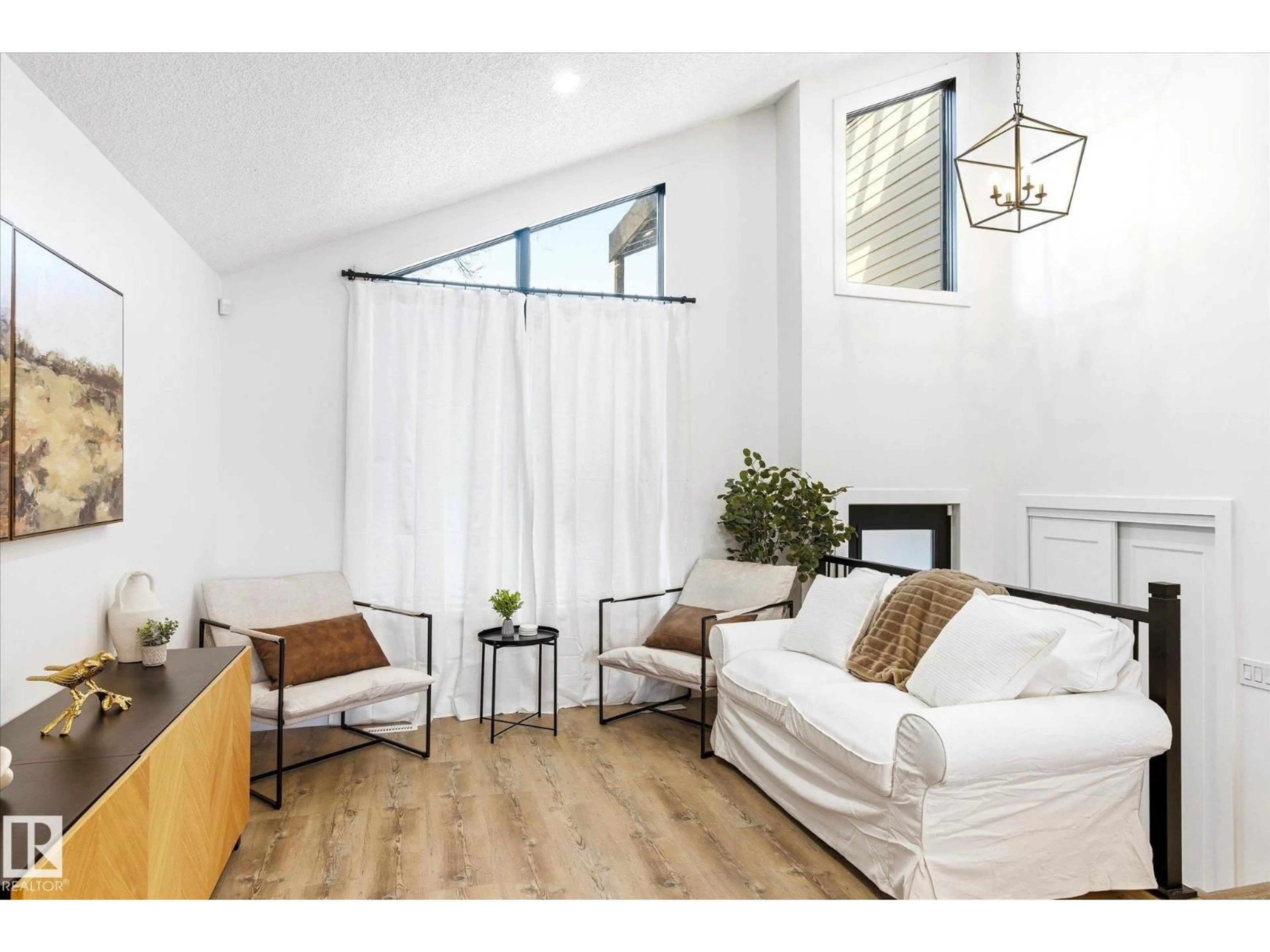 Living room with furniture, wood/laminate floor for 38 WOODCREST AV, St. Albert Alberta T8N3H5