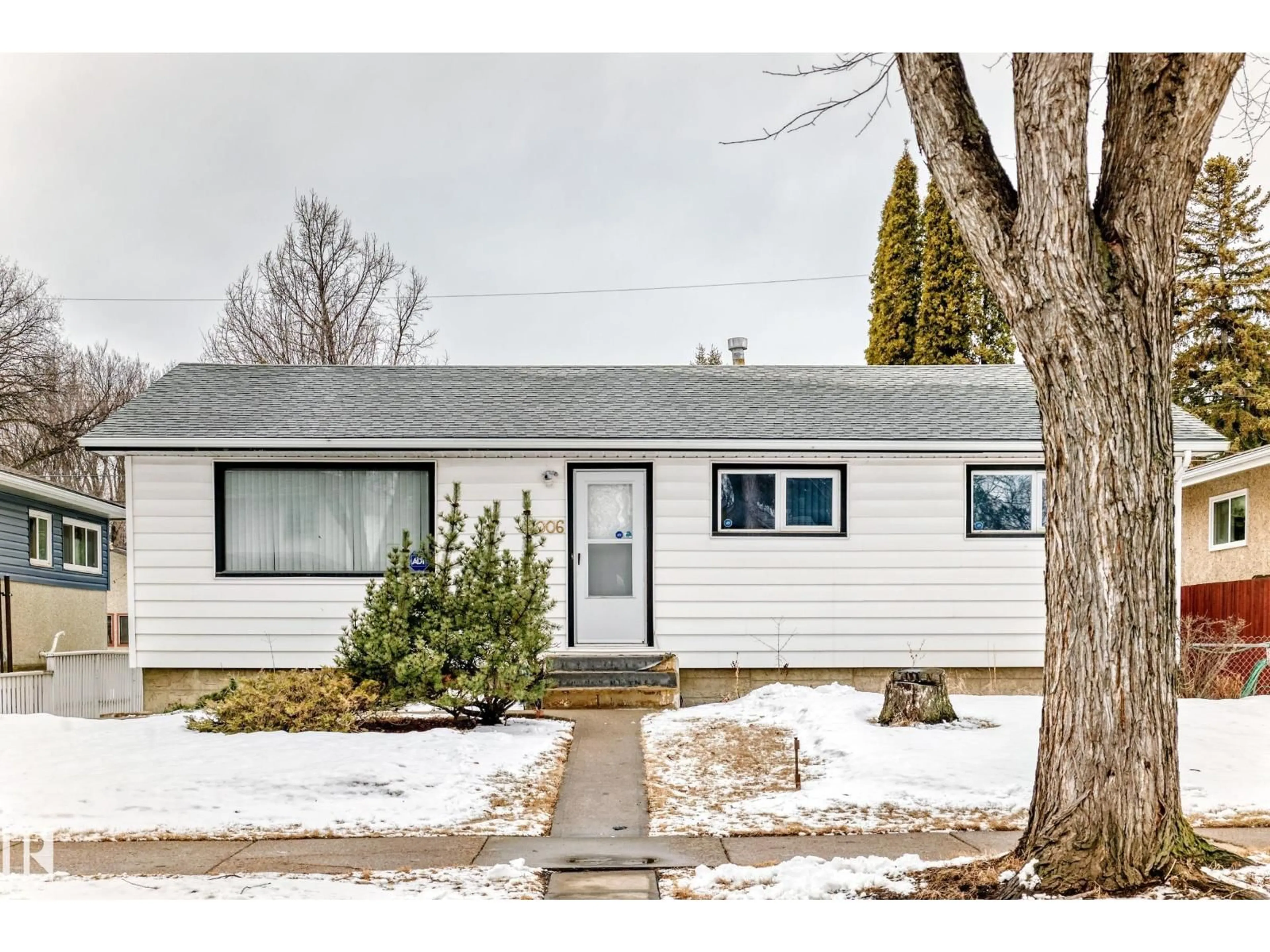 Home with vinyl exterior material, street for 12006 41 ST, Edmonton Alberta T5W2M4