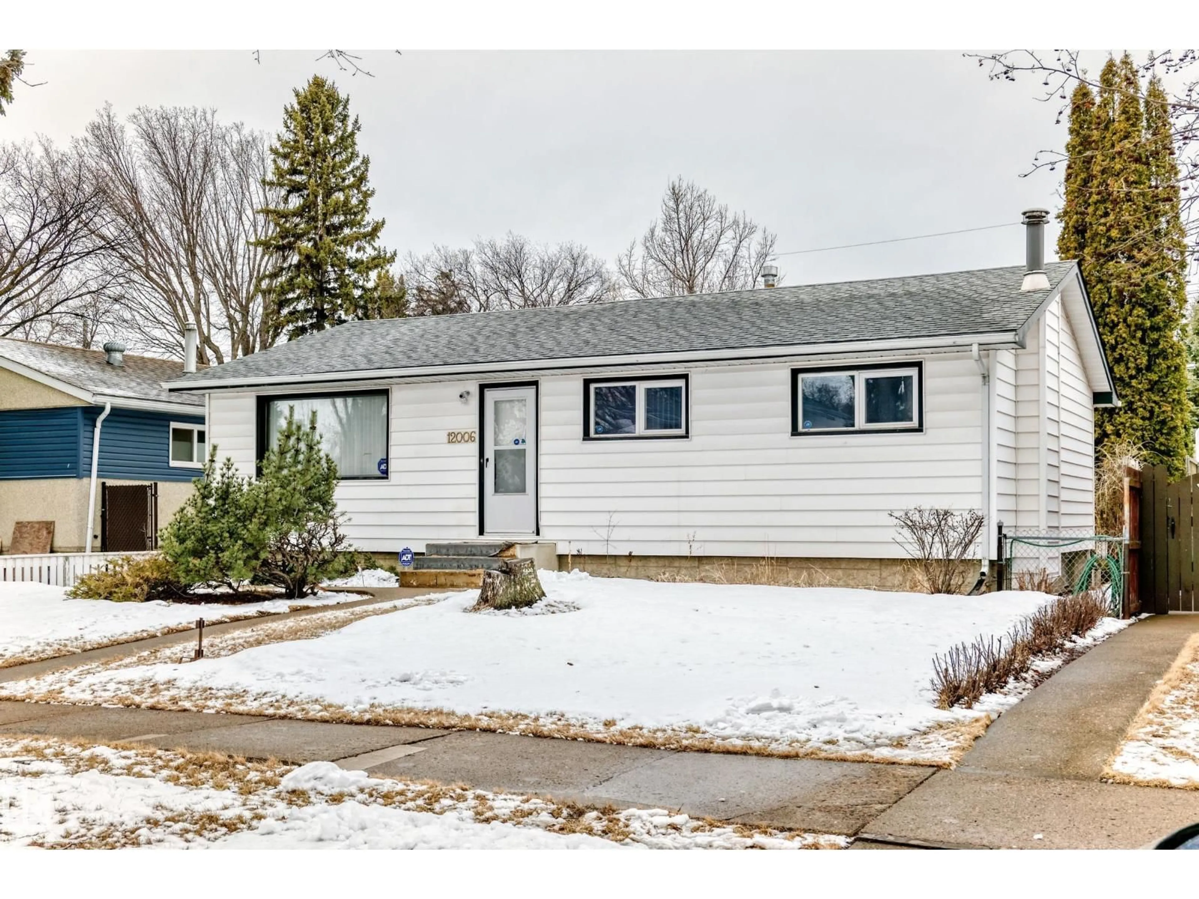 Home with vinyl exterior material, street for 12006 41 ST, Edmonton Alberta T5W2M4