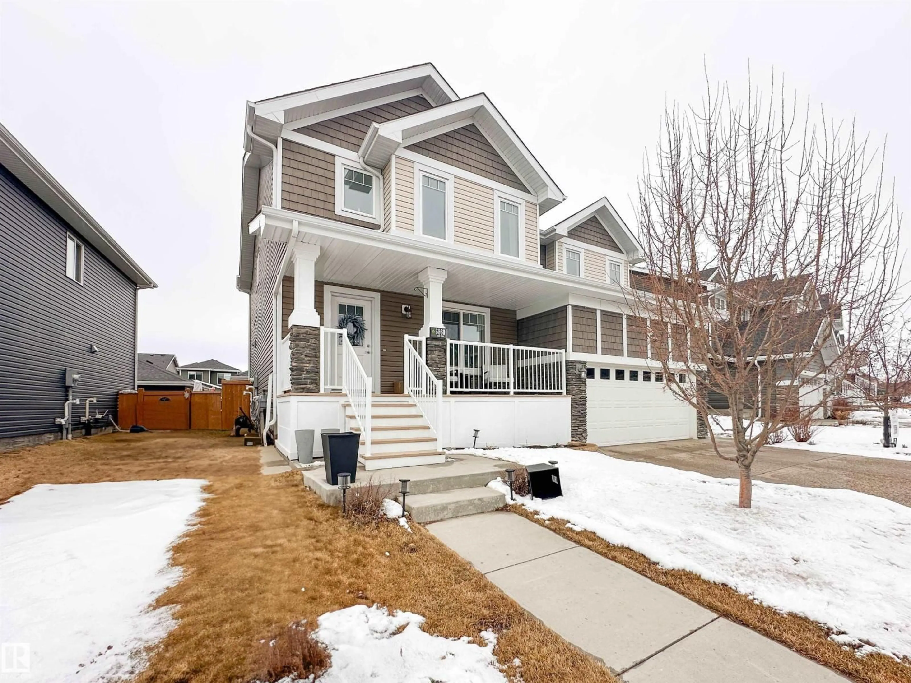 Home with vinyl exterior material, street for 6860 EVANS WD, Edmonton Alberta T6M0T6