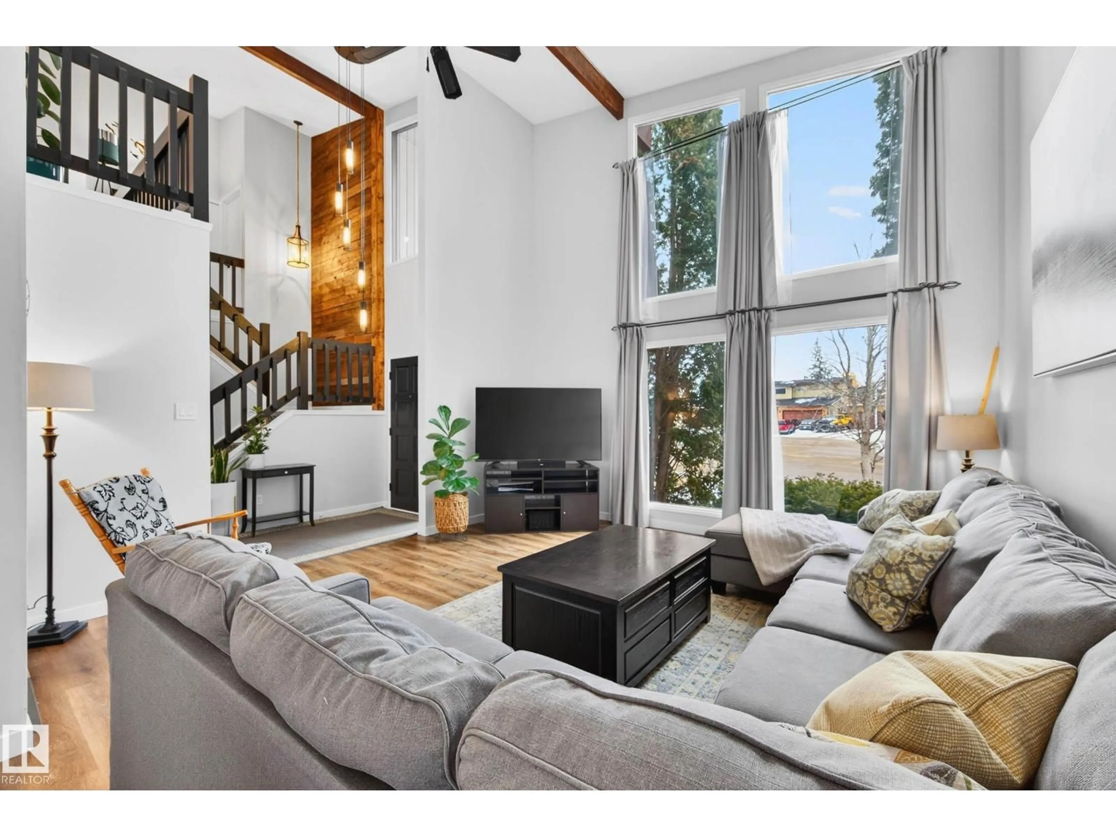 Living room with furniture, wood/laminate floor for 6118 37A AV, Edmonton Alberta T6L1H4