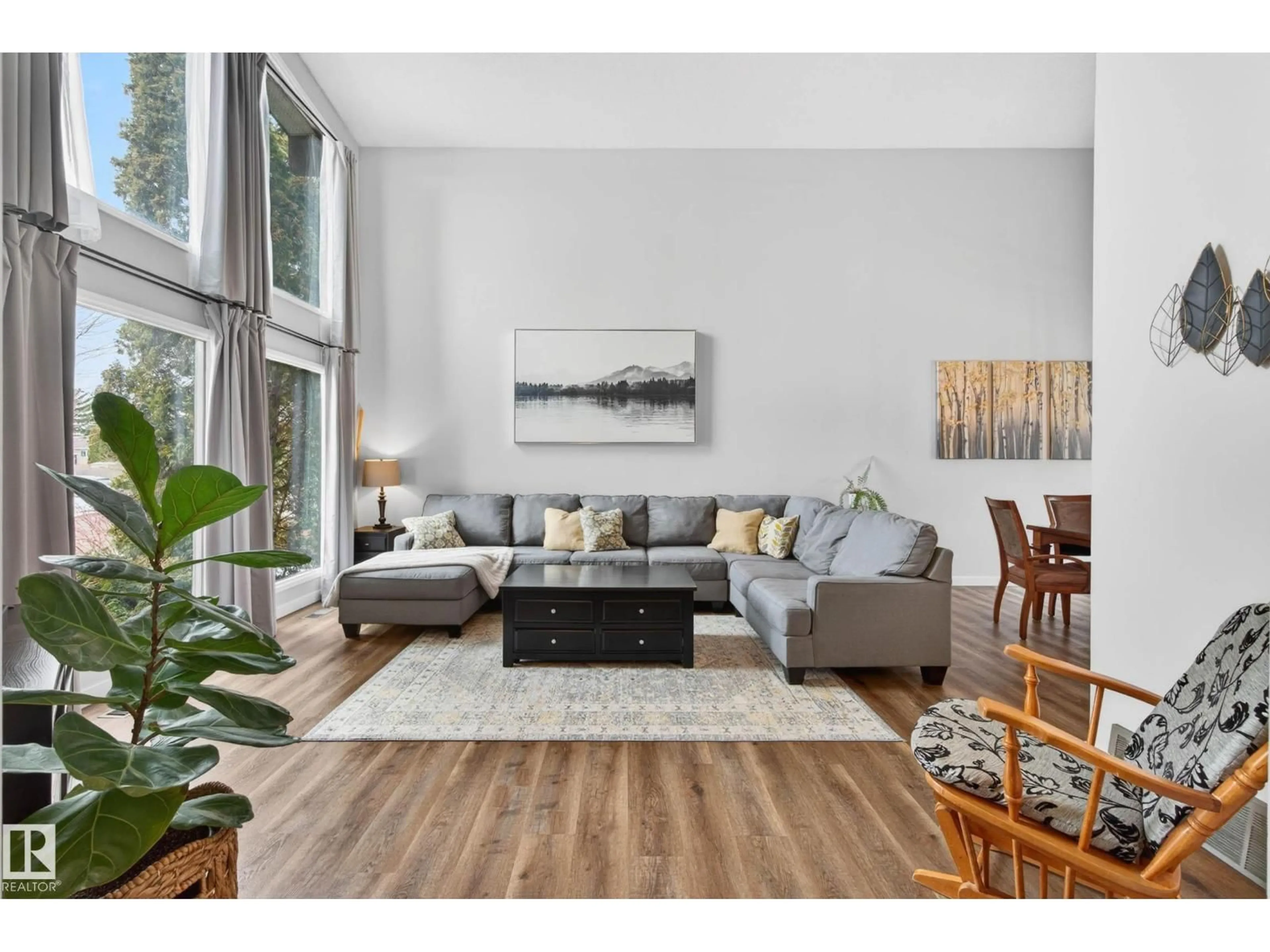 Living room with furniture, wood/laminate floor for 6118 37A AV, Edmonton Alberta T6L1H4