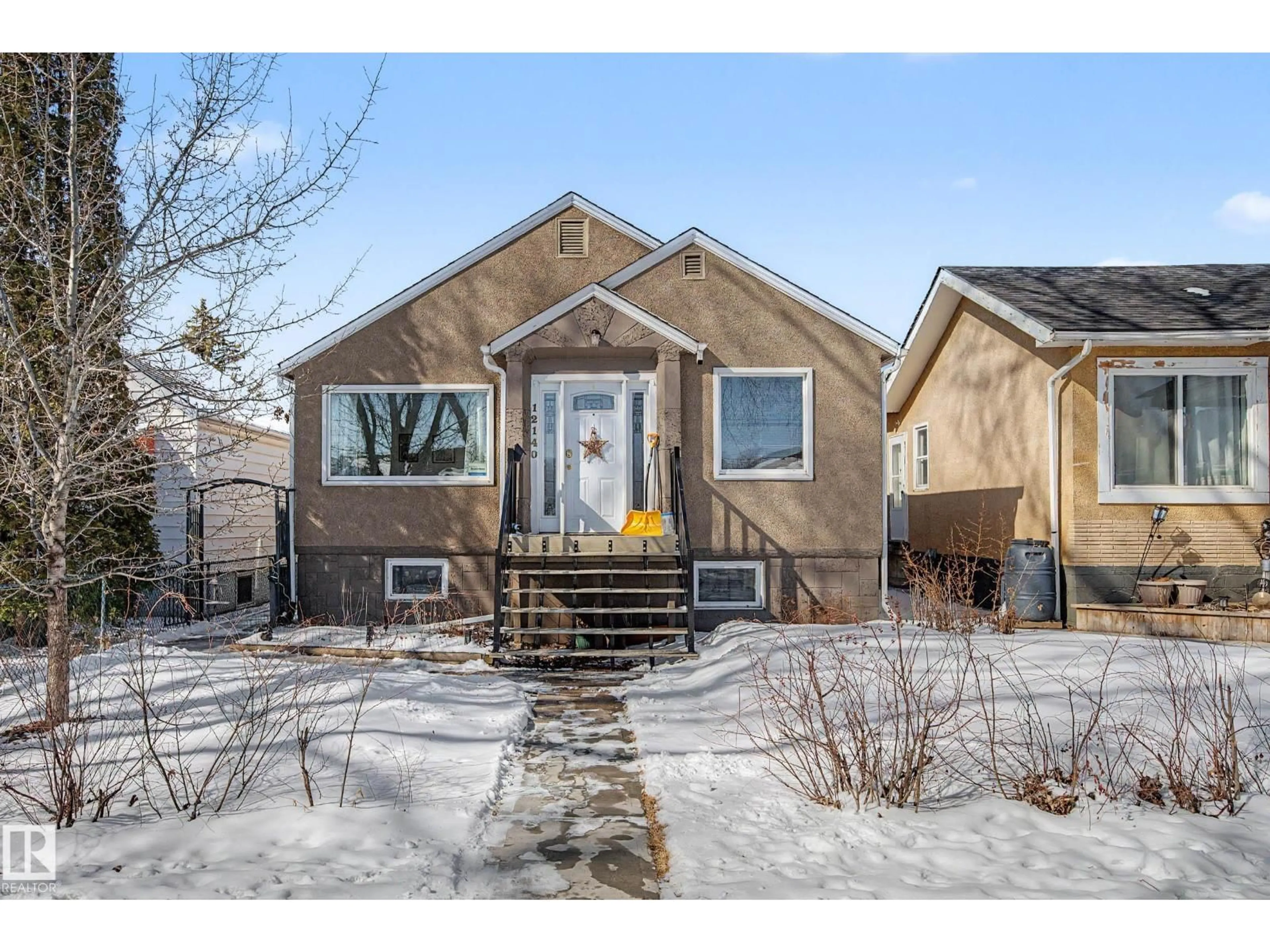 Home with brick exterior material, street for 12140 91 ST, Edmonton Alberta T5B4C1