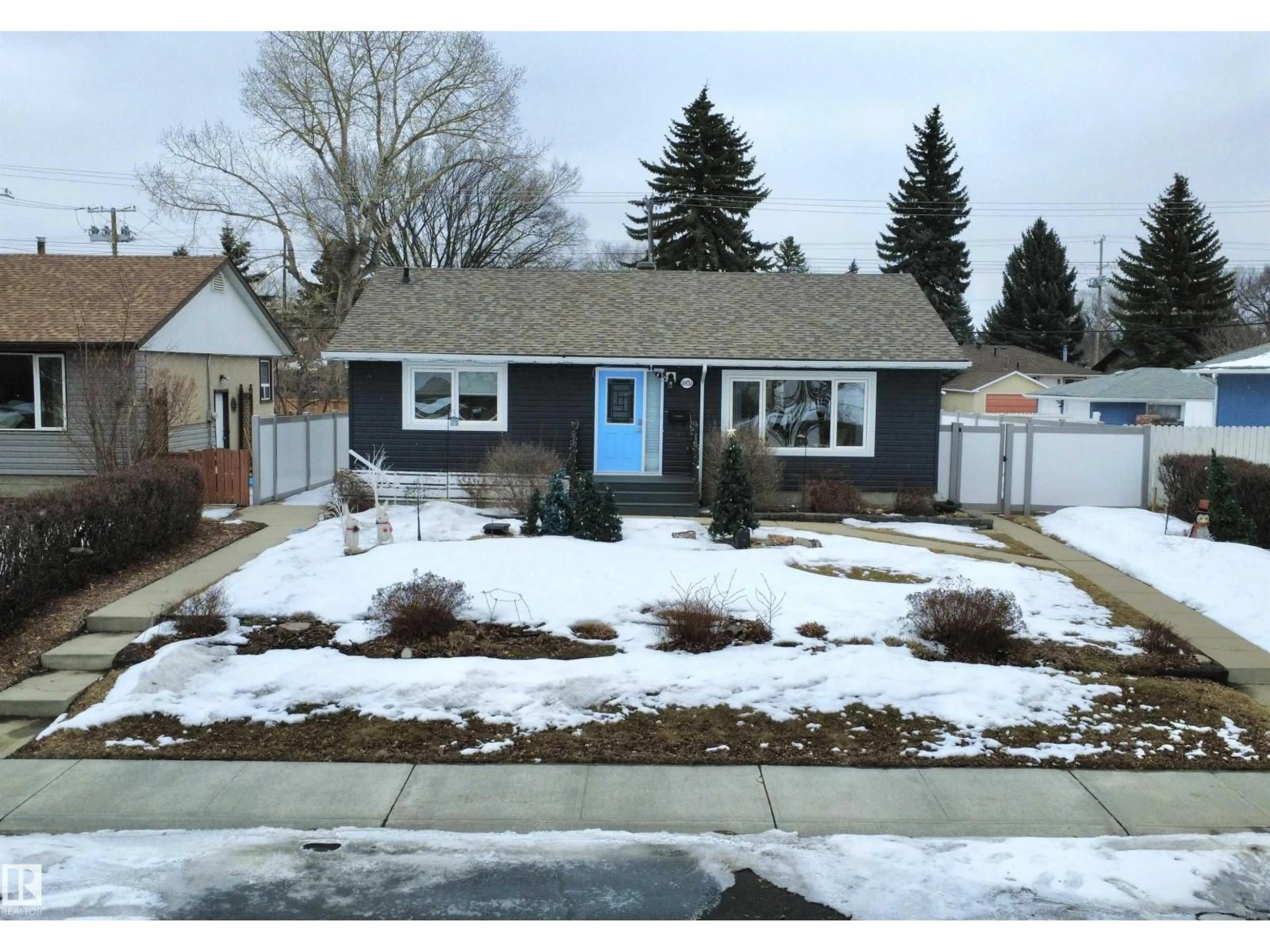 Home with vinyl exterior material, street for 10655 52 ST, Edmonton Alberta T6A2H1